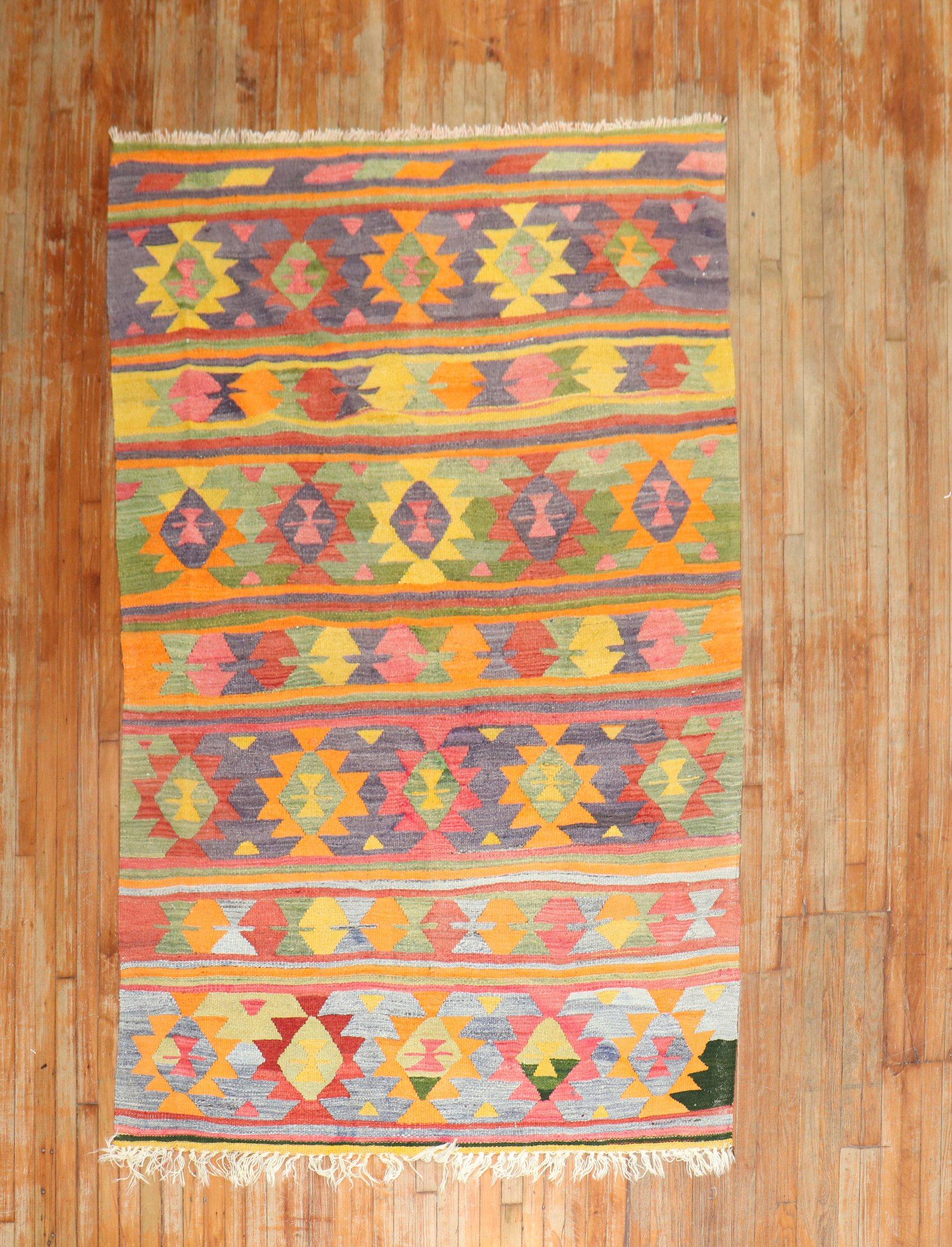 3rd Quarter of the 20th century Turkish Kilim in fun colors.

Measures: 5'6