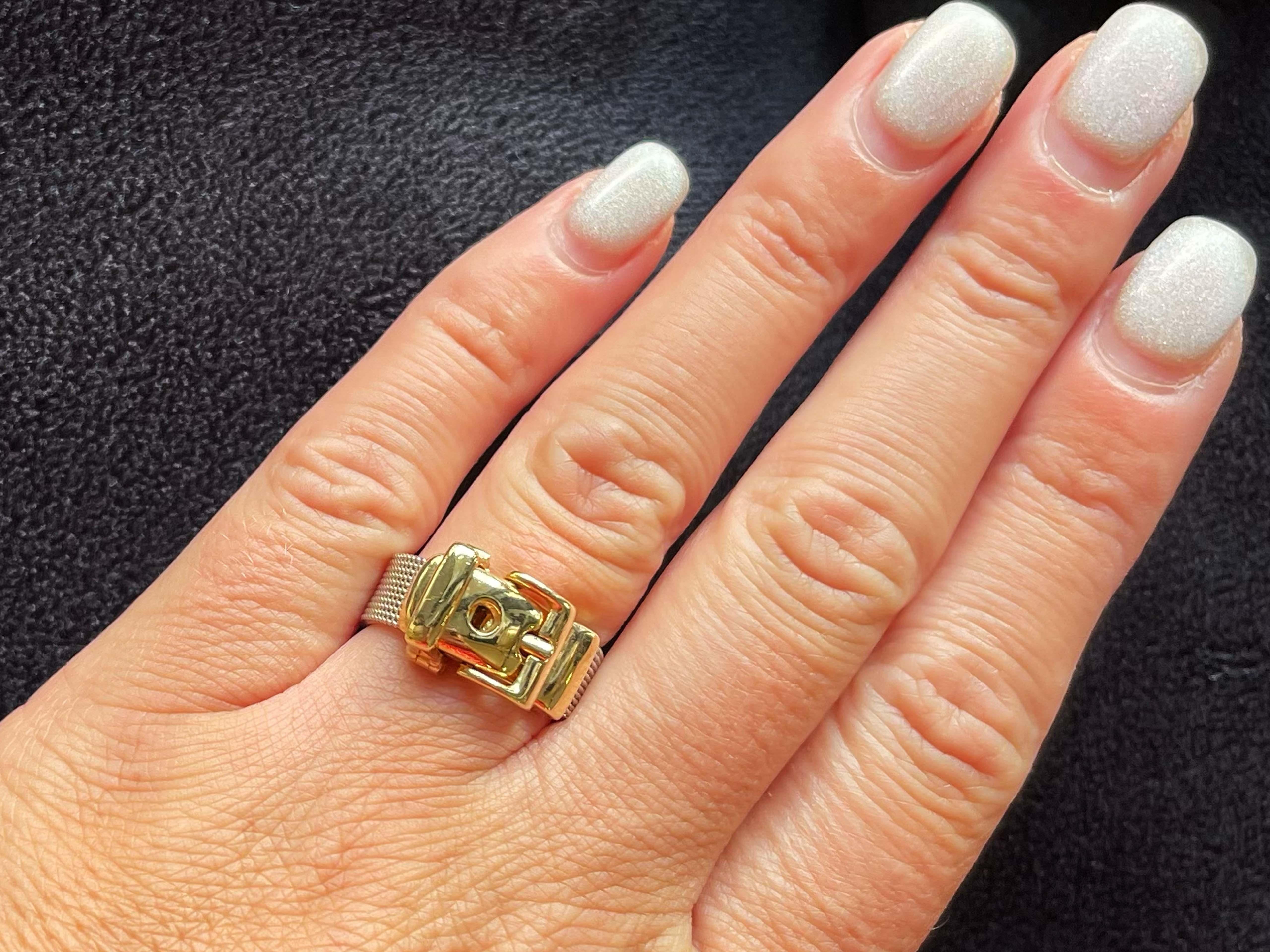Item Specifications:

Metal: 14K Yellow and White Gold

Style: Statement Ring

Ring Size: 7.5 or 9.5 when looped in other hole

Total Weight: 6.1 Grams

Condition: Preowned, excellent

Stamped: 