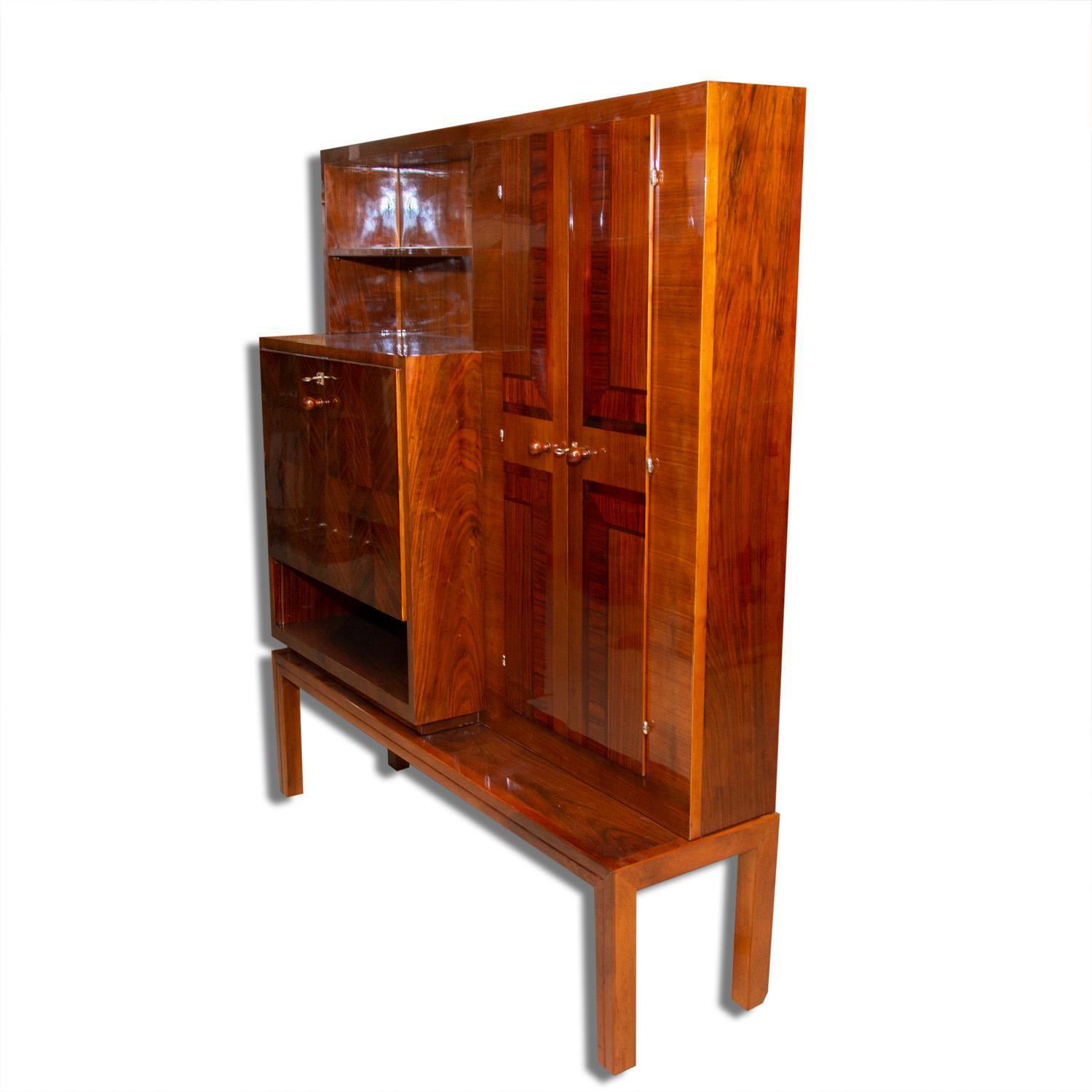 Fully restored functionalist secretary or sideboard. It´s suitable for both the living area and the entrance hall, etc. It can also be used as a dressing table.... It was made in the 1930s in Bohemia. It is made of solid wood in walnut veneer and