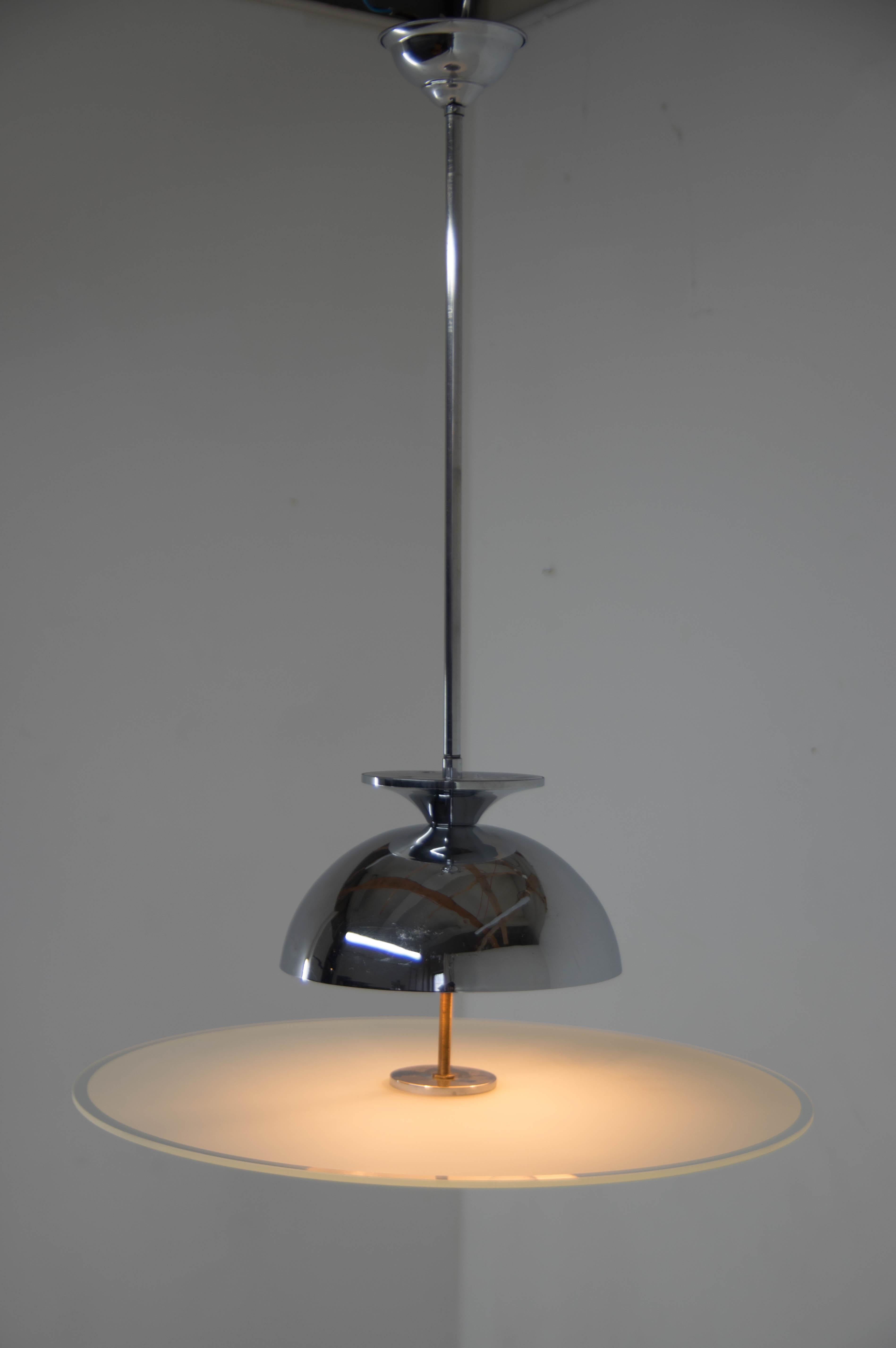 Very elegant Bauhaus/Functionalist chandelier made of chrome and sandblasted glass.
Chrome in good condition with minor scratches, polished
Glass in perfect condition.
Rewired: 2x40W, E25-E27 bulbs
US wiring compatible.
 