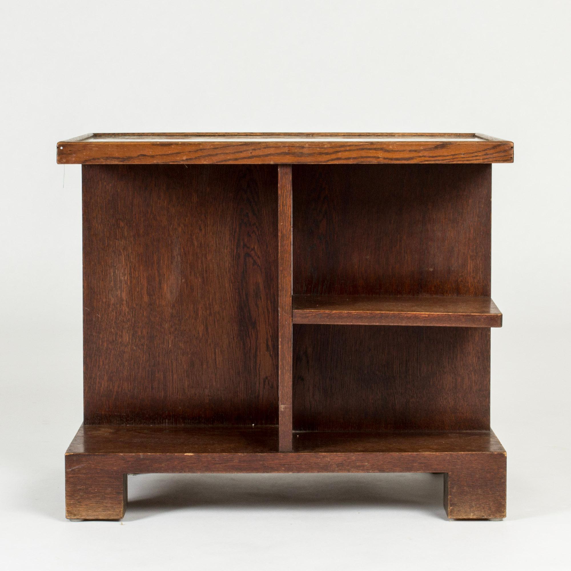 Striking functionalist console table by Axel Larsson, made from stained wood with shelves under the table top. Copper top underneath a glass sheet. This model was so that the owner’s could insert their own fabric, photos, travel memories and the