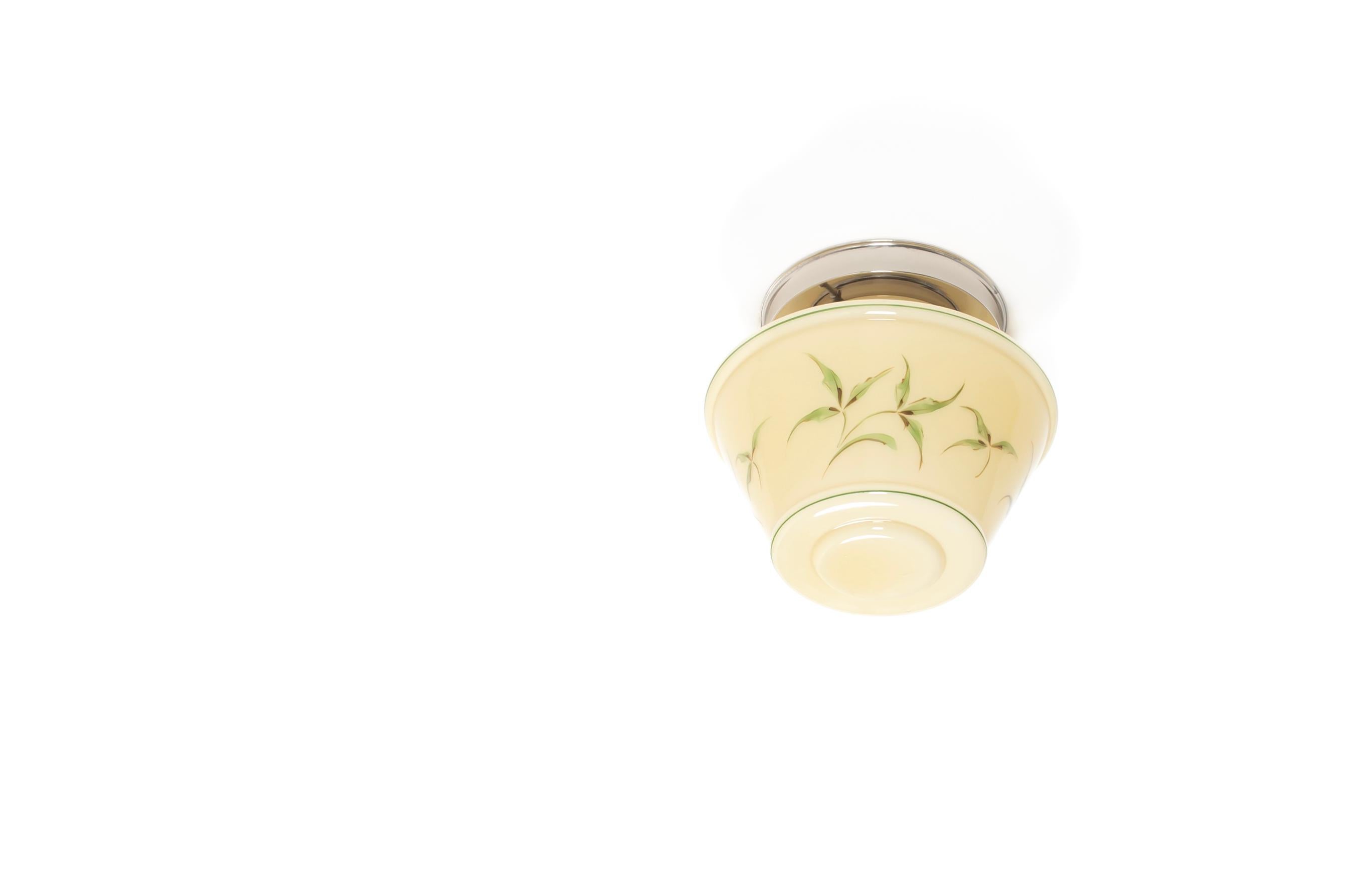 Wonderful and decorative ceiling light with handpainted shade in opaline glass and chrome metal base. Designed and made in Norway from ca 1950s first half. The lamp is fully working and in good vintage condition. It is fitted with one E27 bulb