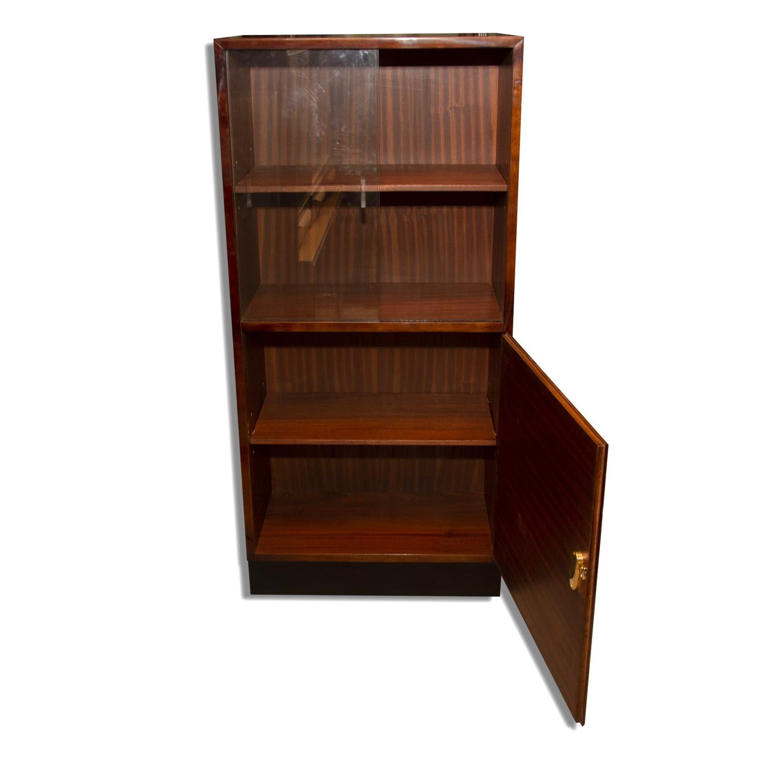 Fully renovated functionalist cabinet, catalogue number H-27. It was made in the 1930s of the last century and was designed by Jindrich Halabala for ÚP Závody Brno. 
Material: wood, walnut veneer. The cabinet was fully restored to a high gloss
