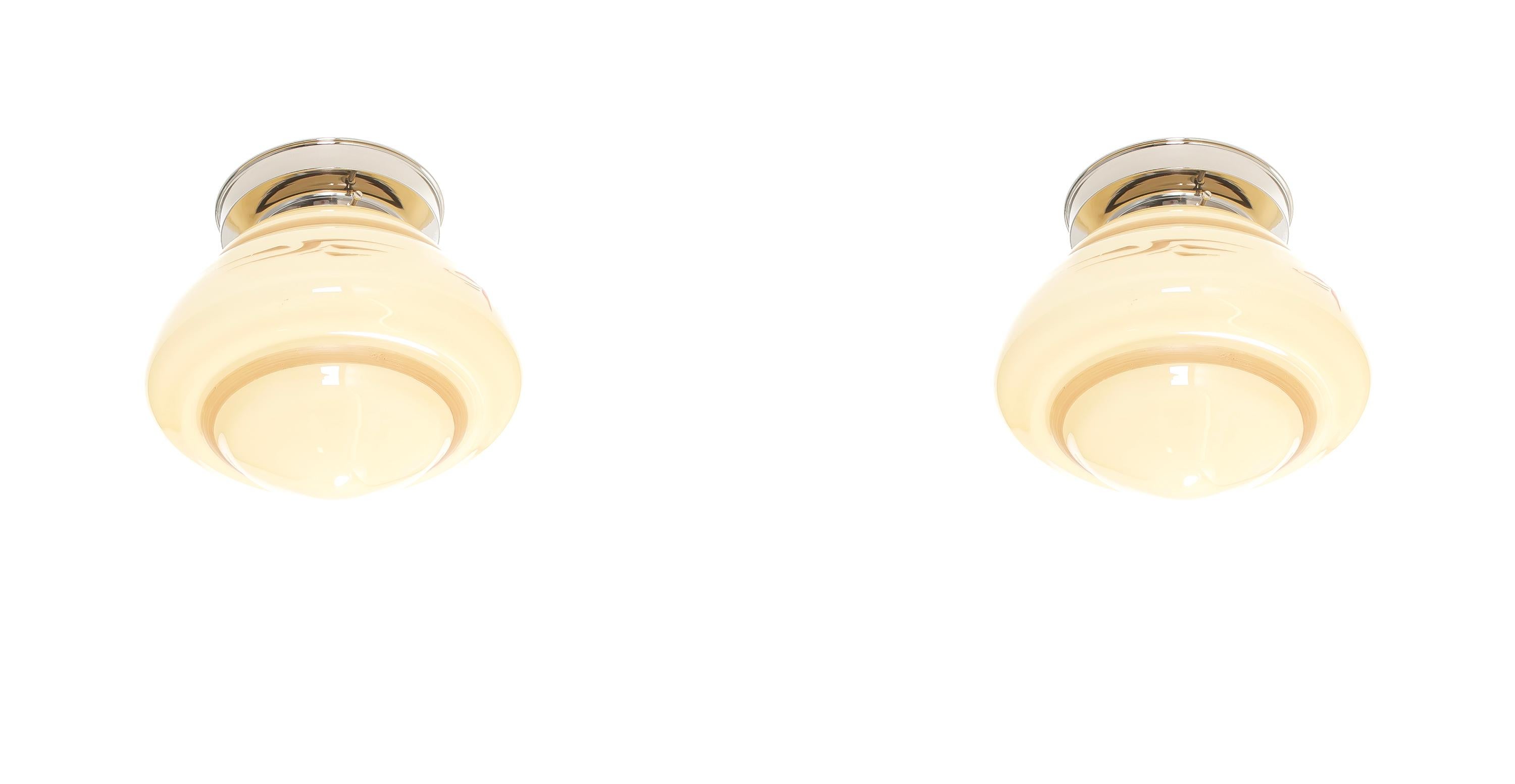Wonderful ceiling lights with decorated opaline shade and base in chrome. Designed and made in Norway from circa 1950s first half. Both lamps are fully working and in good vintage condition. Each lamp is fitted with one E27 bulb holder (works in the