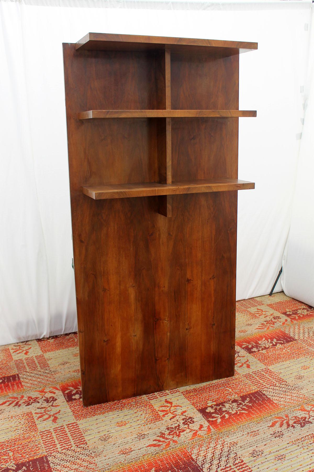 This Wall shelf or bookcase was made in the former Czechoslovakia in the 1930s, 
It´s made of walnut, you hang it on the wall using two screws.
dimensions of shelves is 70x23x3cm, between 1st and 2nd shelf is 27 cm, between 2nd and 3rd shelf is