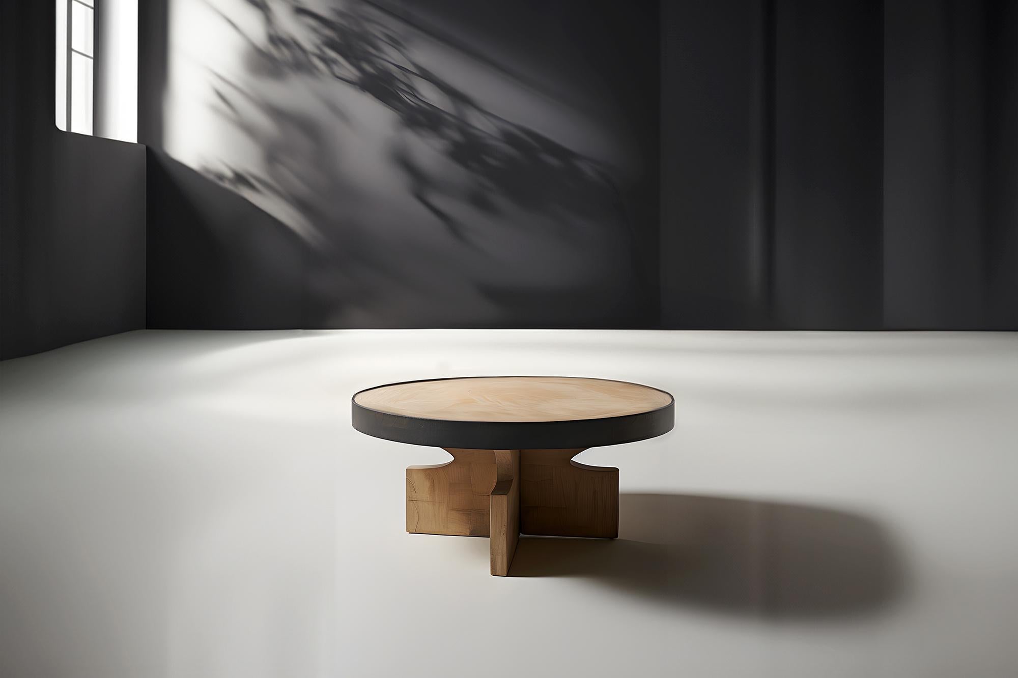 Fundamenta Round Side Table 60 Solid Wood, Geometric Elegance by NONO
Sculptural coffee table made of solid wood with a natural water-based or black tinted finish. Due to the nature of the production process, each piece may vary in grain, texture,