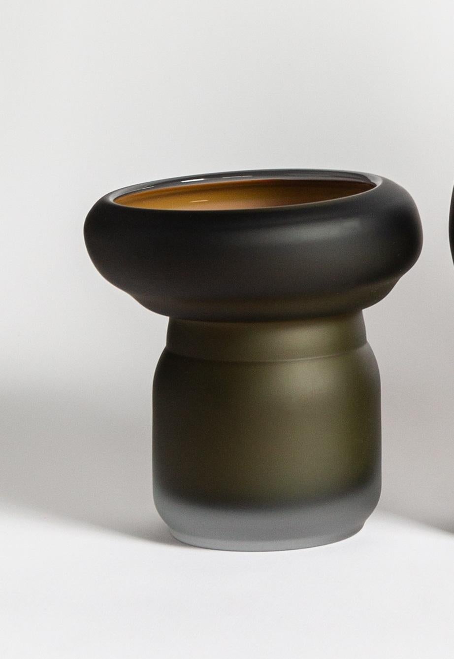 Fungus Small Vase by David Valner
Dimensions: D 15 x W 16 x H 23 cm.
Materials: Glass.
Weight: 2 kg.
Finish: Small size, dark green and beige, and matte surface.

“The mystery of mycelia speaking through glass”

Fungi and moulds are organisms