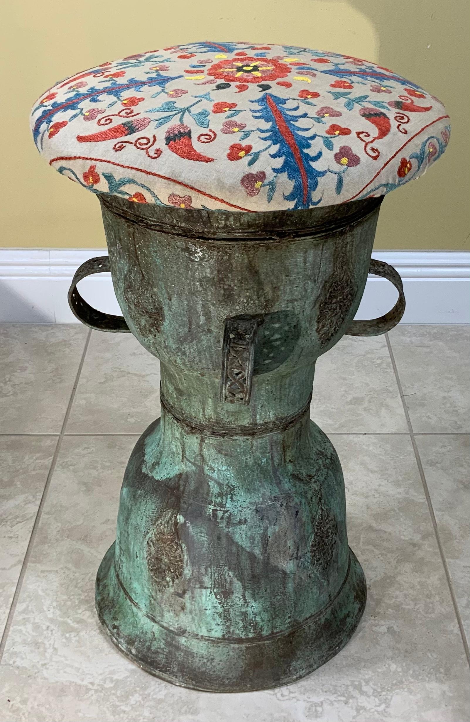 Exceptional stool artistically made of hand embroidery vintage silk embroidery Suzani textile top, professionally mounted on antique bronze antique Chinese rain drum base, with four decorative handles. Beautiful object of art for room display. Base