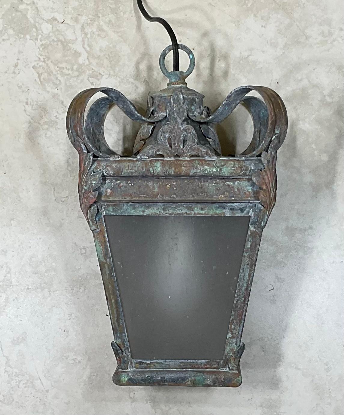 Elegant hanging lantern made of solid brass quality workmanship with beautiful style of a crown top, electrified with one 60/watt light ready to light. Milky acrylic glass like.
3 more available upon request.