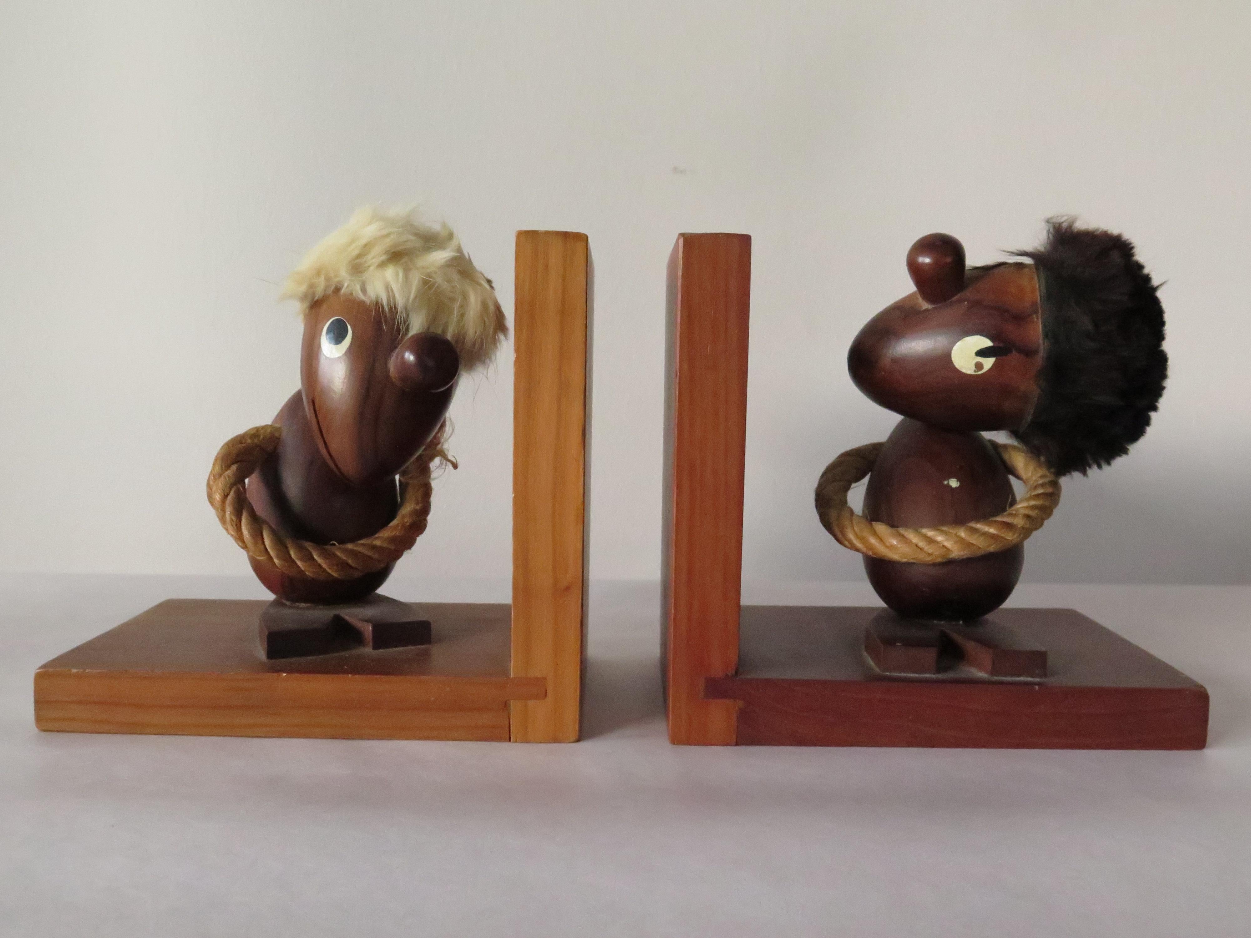 Funky Danish bookends-blond guy and dark guy caricatures! Well made and hand painted.