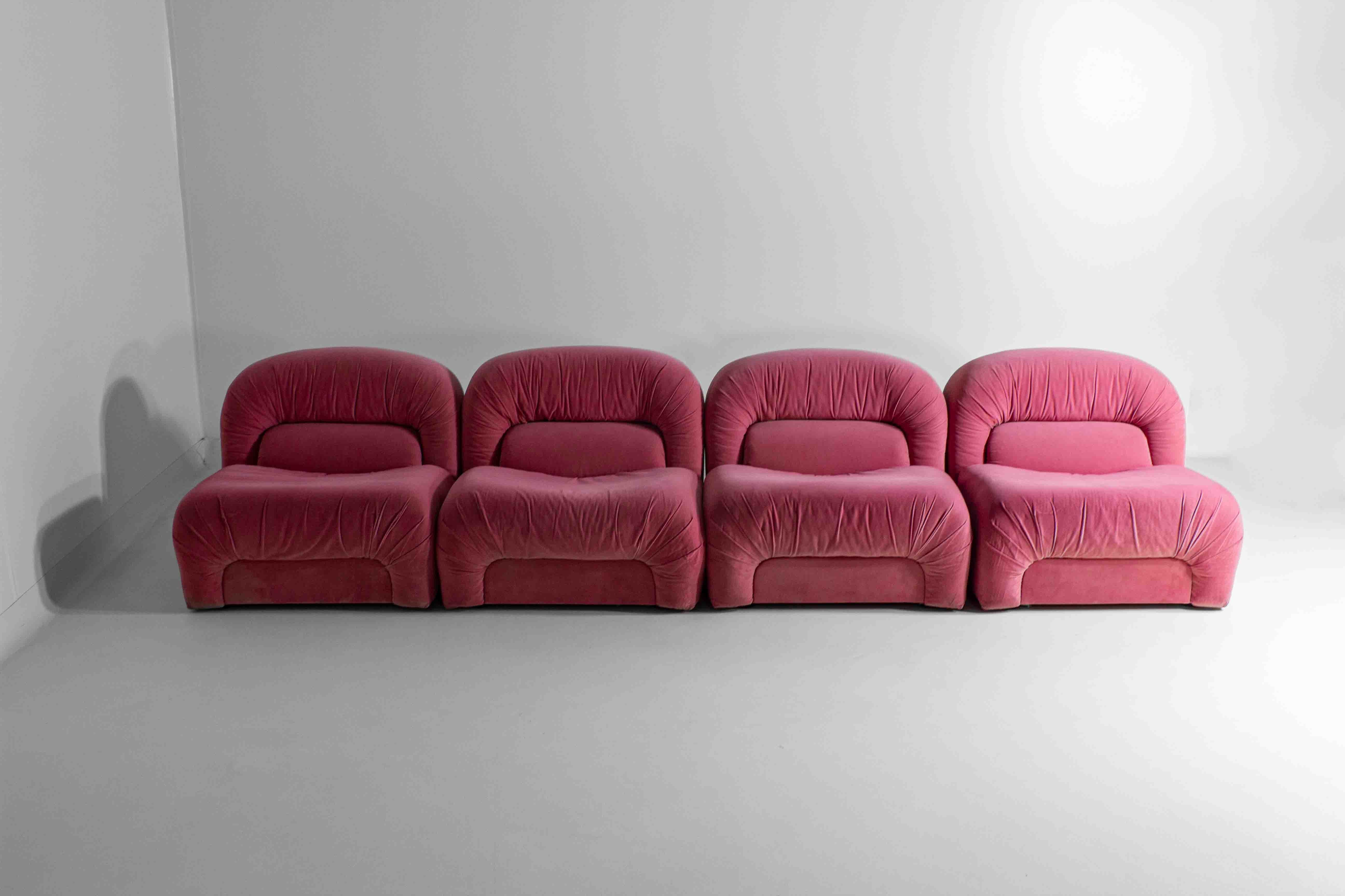 This modular Italian sofa, upholstered in playful pink velvet, embodies the vibrant and experimental design spirit of the 70s. Known for its distinctive and rounded shapes, this sofa offers both visual appeal and comfort. The modular nature allows