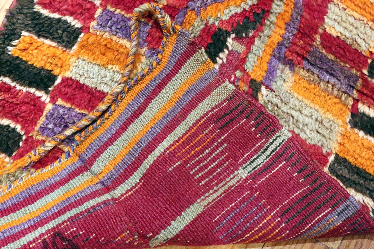 Highly artistic and funky purple vintage Moroccan runner rug, Country of origin / Rugs type: Moroccan rugs, date circa mid-20th century. Size: 1 ft 9 in x 15 ft (0.53 m x 4.57 m). 

This cheerful vintage runner rug from Morocco will fool you into