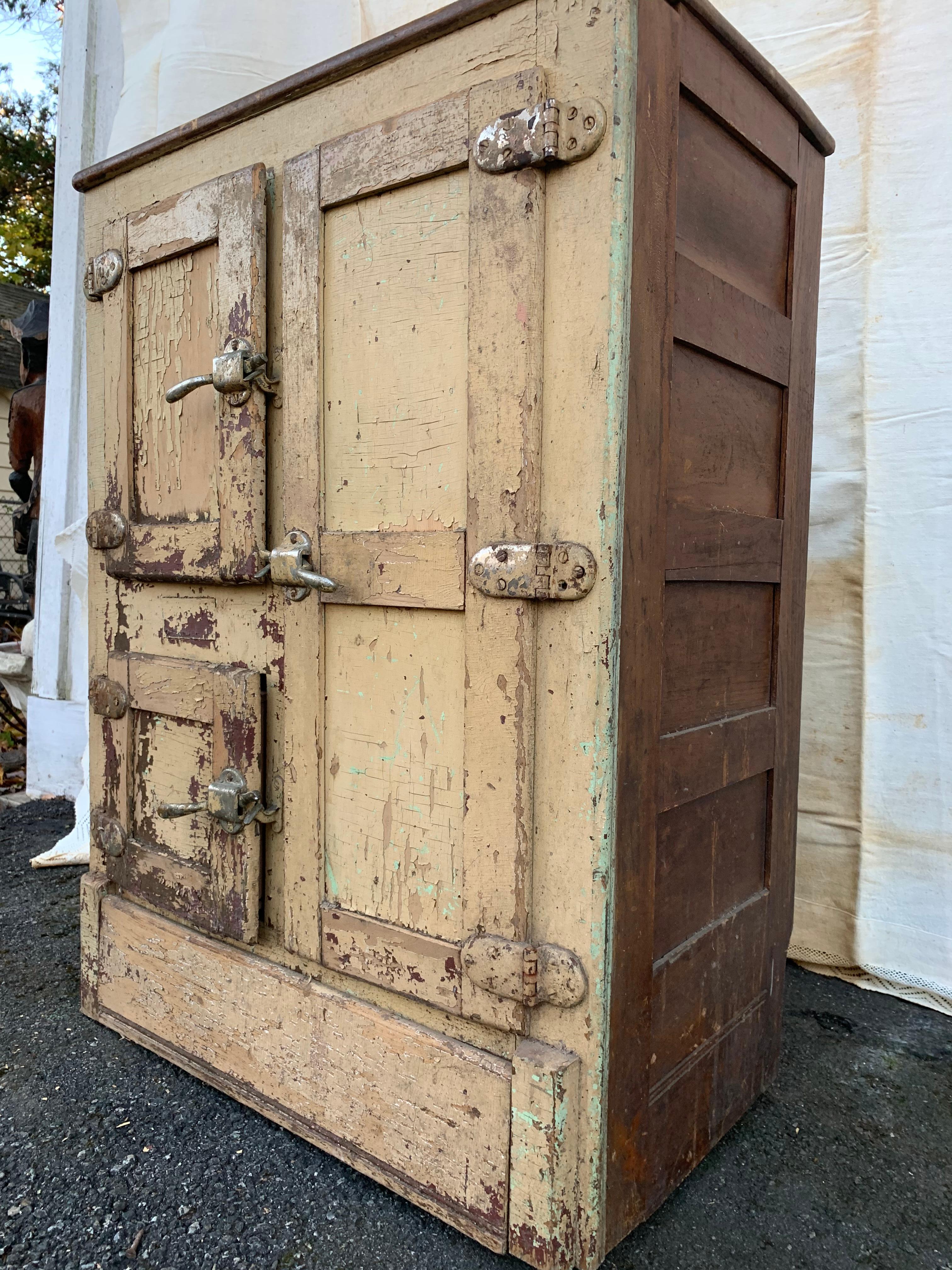 A funky distressed vintage ice chest with great original chippy paint with lots of character. A cool piece to use for storage with an industrial vibe.