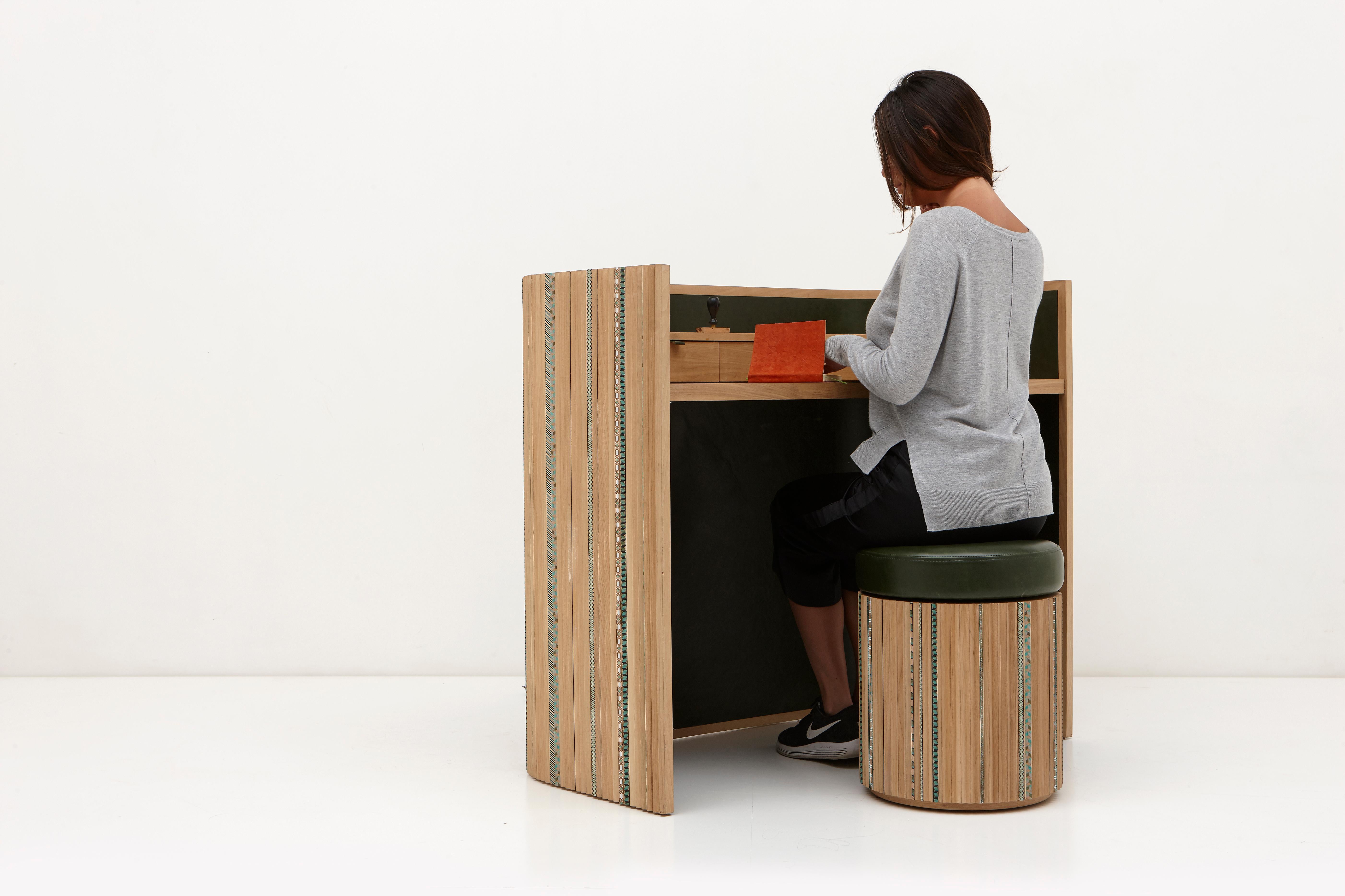 The aim of this collection is to create a new dialogue around craft that has room for playfulness and joy too. It is reflected in the Funquetry pleated secretaire, a compartment desk where strips of different colored wood are sliced and then applied