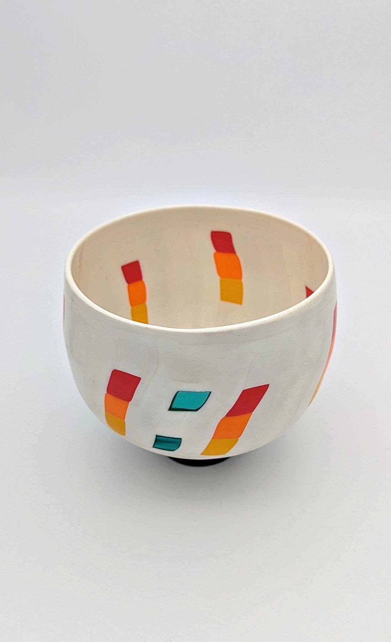 The Funtime's cups is a series of unique footed bowls created by Japanese artist Tsuchida Yasuhiko on the island of Murano. This particular Funtime's cup is a mosaic of glass canes and pieces composes and fused together, then rolled up on the glass