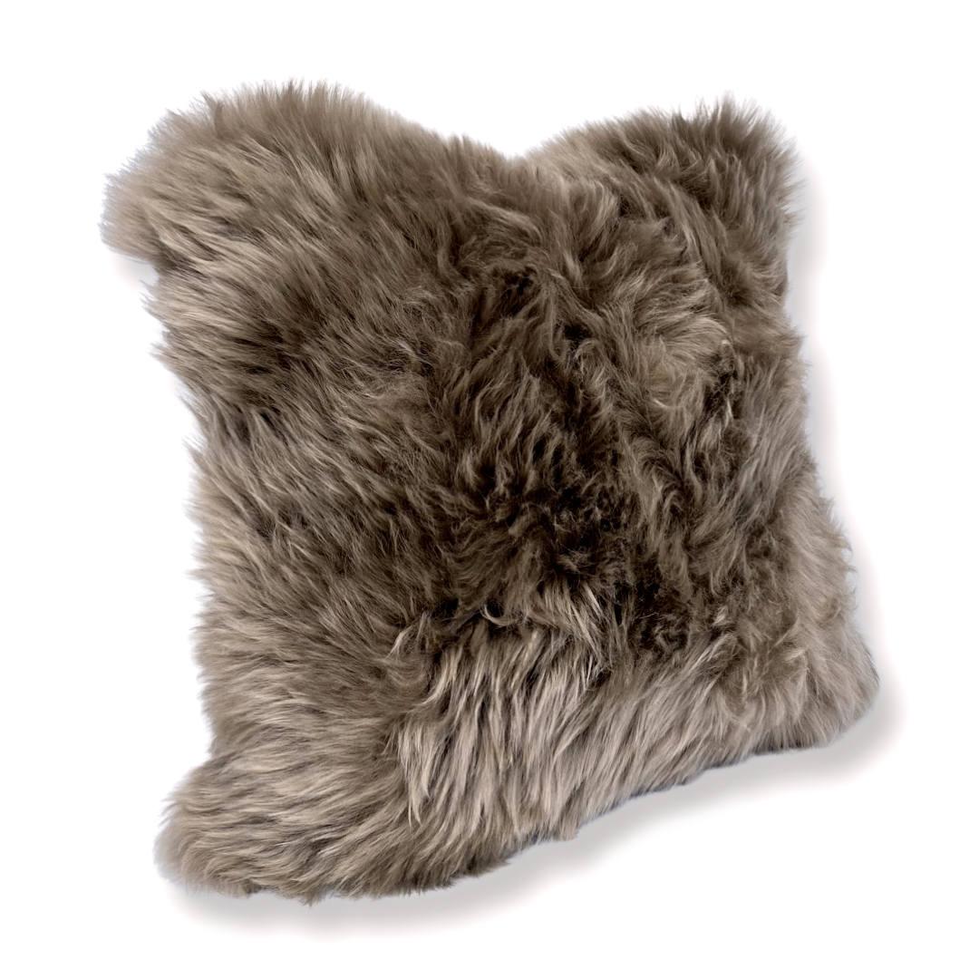 Introduce rich and enchanting accents to an interior with these sumptuous taupe pillows. With an irresitible pure wool pile and superior silky softness, this collection of fluffy pillows is hand-crafted from beautiful high-quality New Zealand