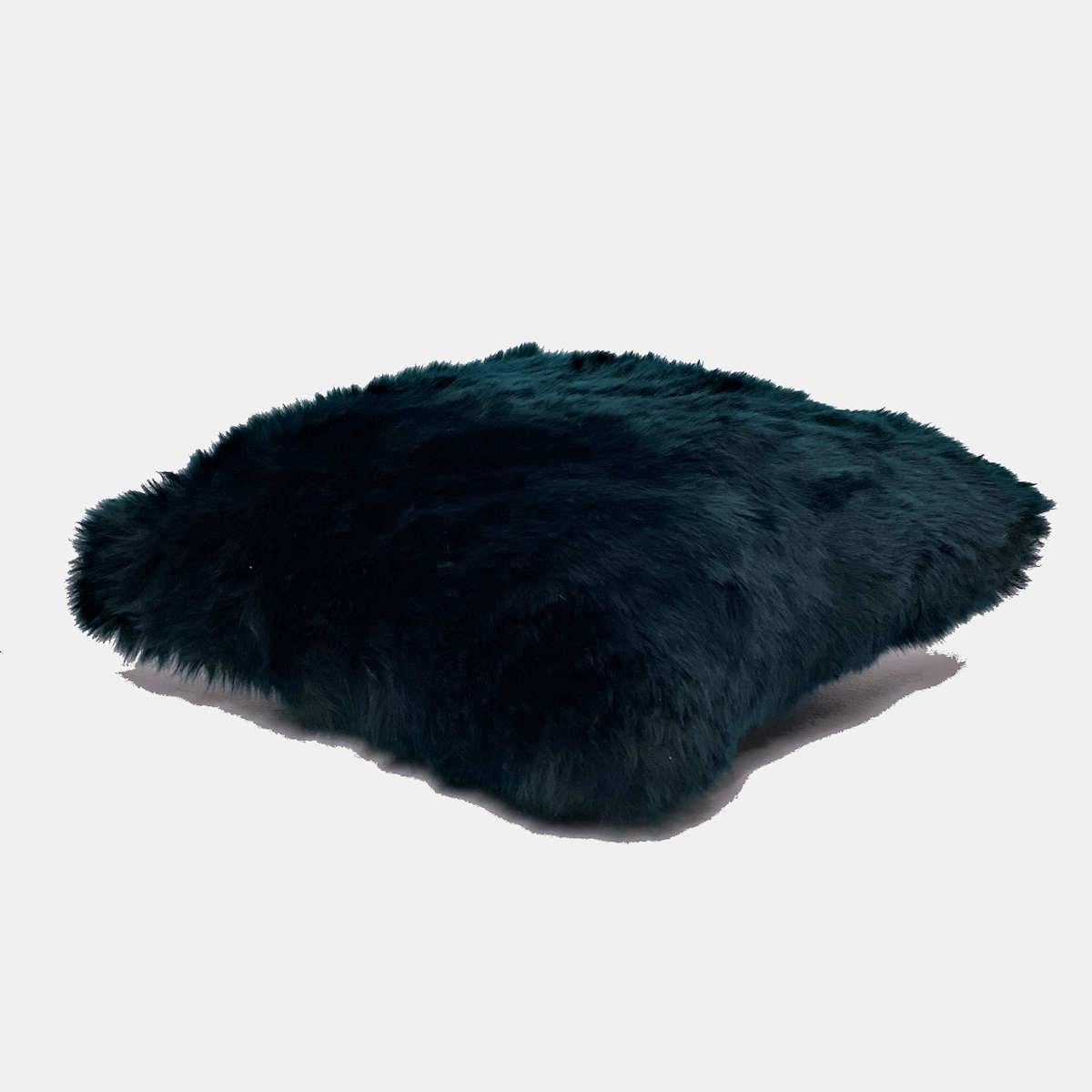 Introduce rich and irresistible tactile elements to your decor with this sumptuous teal fur pillow. Featuring a pure wool pile with superior silky softness, this collection of fluffy pillows is hand-crafted from beautiful high-quality New Zealand