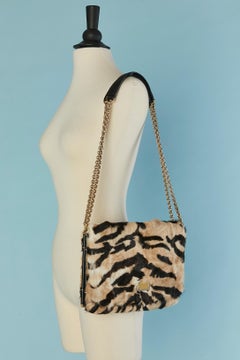 Fur shoulder bag with tiger print and gold metal chain Dolce & Gabbana