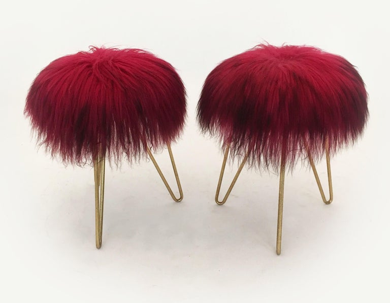 A pair of fine long haired fuchsia colored fur stools, France 1950s. The fur is soft and clean without any issues. Perfect to be placed in the living room around a coffee table for occasional seating option. A stylish vintage companion for the
