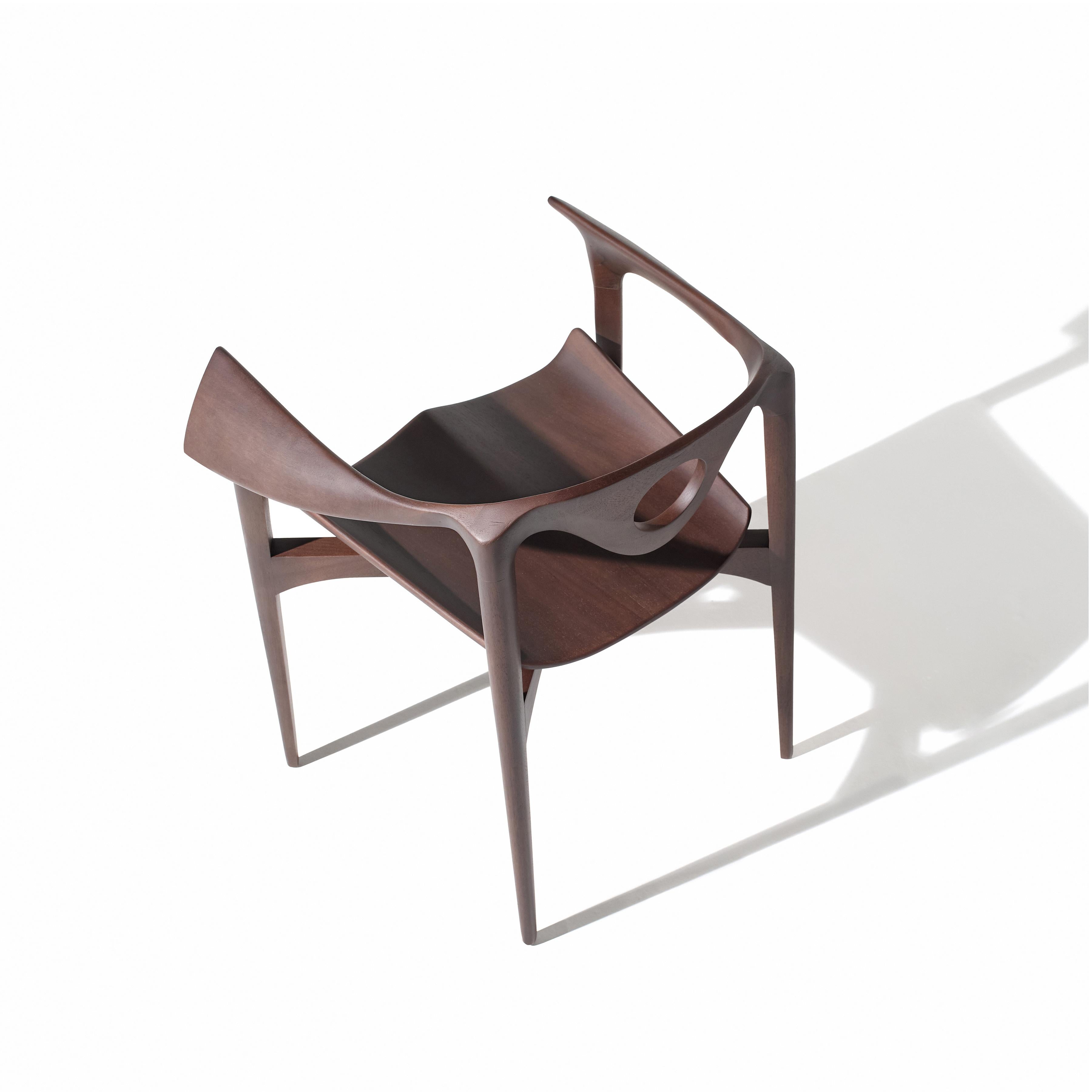 This is perhaps one of the most complex chairs we have ever produced. With carved parts at every corner, including underneath the seat, this piece could not have been made by a craftsman. Instead, a robotic arm, capable of accessing difficult