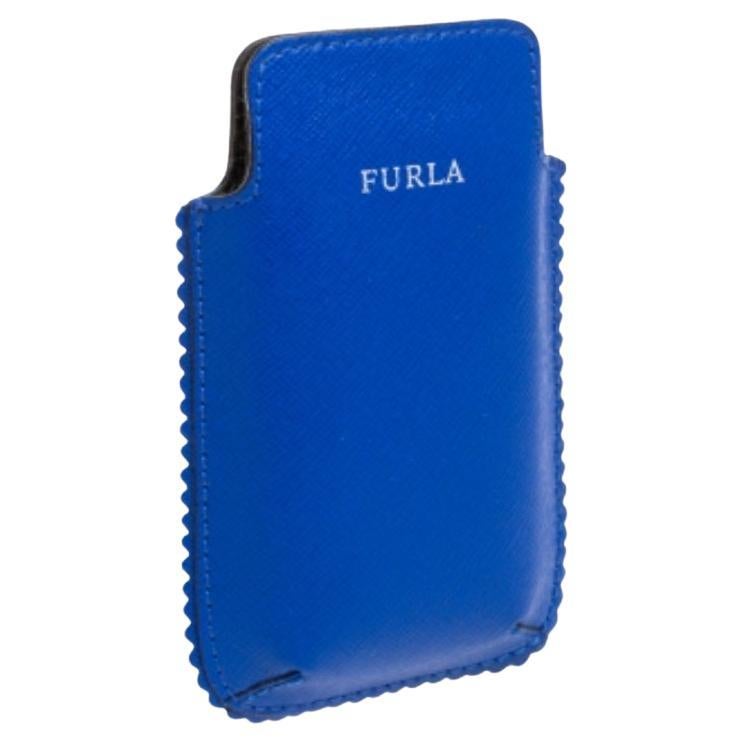 We carry our phones with us wherever we go, and hence, it has to be protected at all times. Crafted from leather in a blue hue, the Furla phone case features a logo on the front and is lined with nylon. The petite scallop trims add to the character