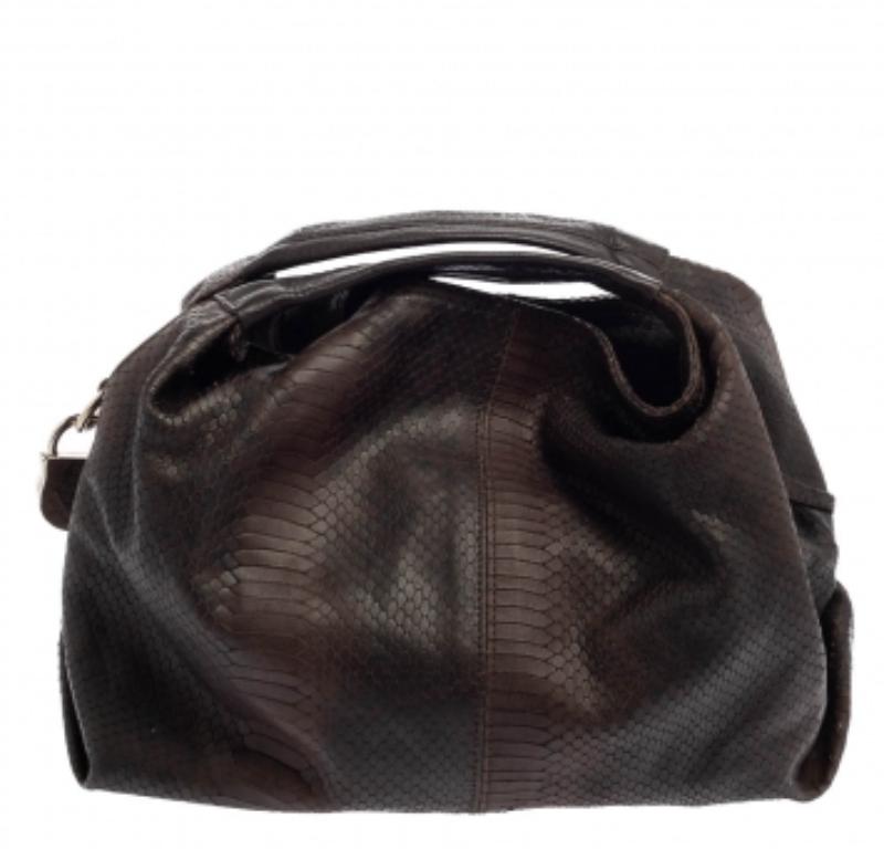 Minimally stylish and high on durability, this Furla hobo will be the perfect pal for your daily errands! It has been crafted from dark brown python-embossed leather and designed in a slouchy silhouette with a single top handle and an attached