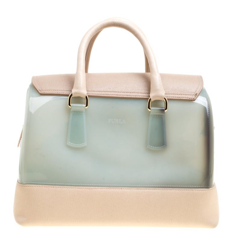 Furla's Candy satchel bag has a fresh and glamourous style. Made from glossy rubber the bag has a simple design. It features dual rolled handles, lock on the front flap and a leather tag. It has a spacious interior and can carry all your daily