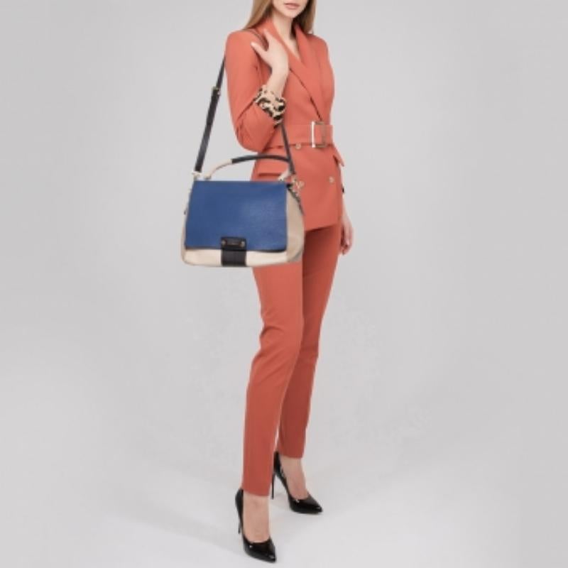 You will enjoy parading this fabulous bag from Furla. It comes made from leather and features a top handle, shoulder strap, gold-tone hardware, and a back pocket. It is equipped with a lined interior meant to hold all your daily essentials with ease.