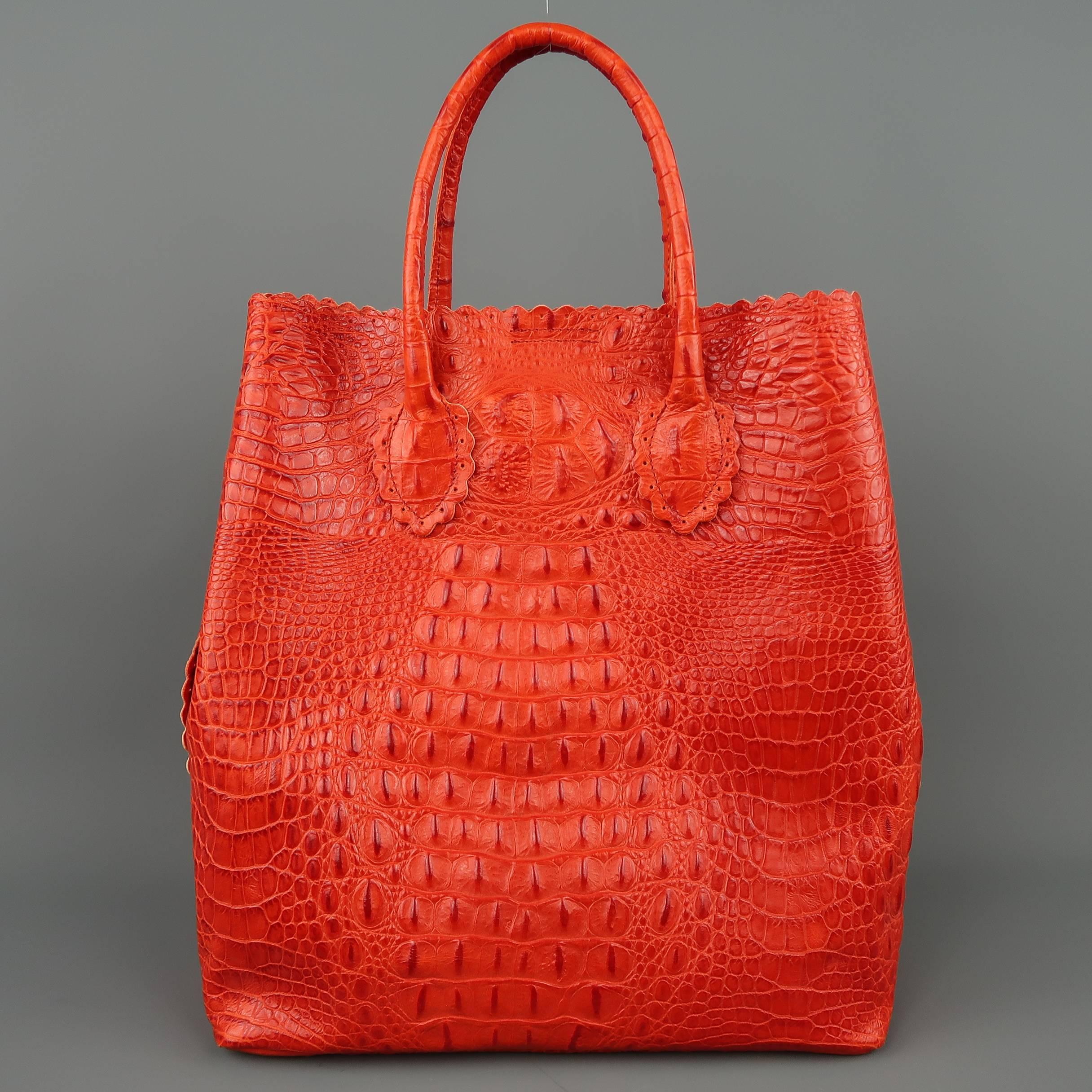FULA tote bag comes in a vibrant orange crocodile embossed leather with scalloped  trim, snap sides, double covered top handles, logo tab, and detachable vinyl inner pouch. With dust bag.
 
Excellent Pre-Owned Condition.
 
Measurements:
 
Length: