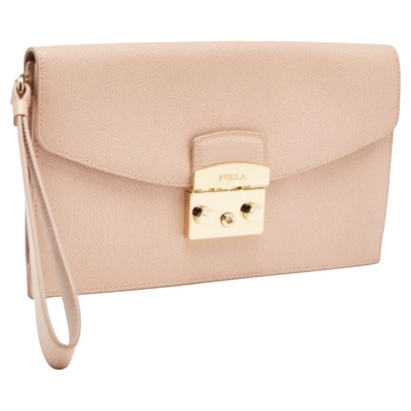 Pochette da polso Furla Metropolis in pelle rosa in vendita