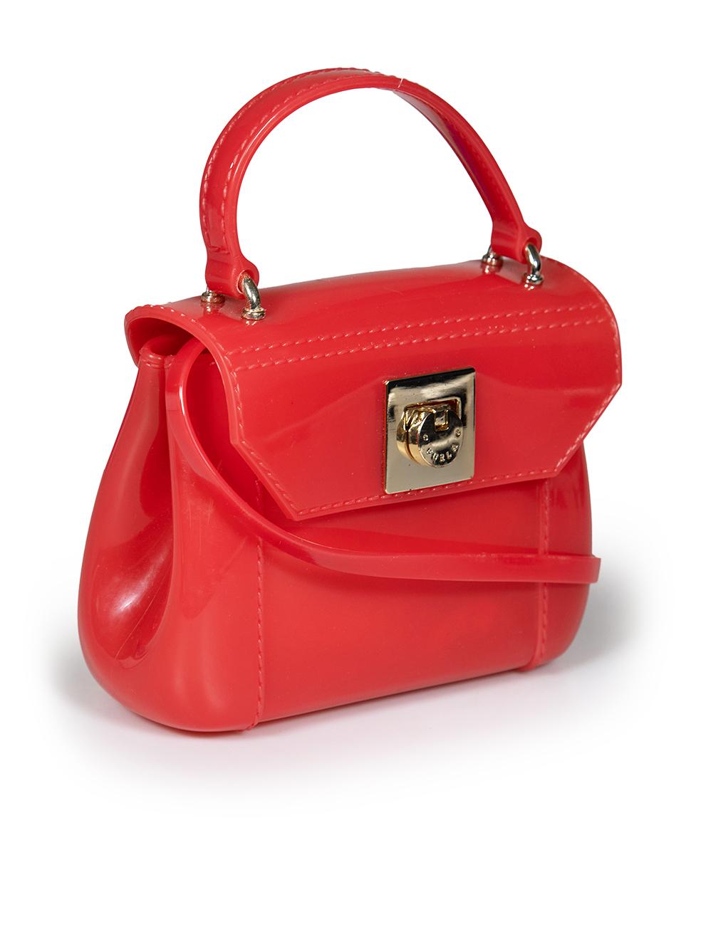 CONDITION is Good. Minor wear to bag is evident. Light wear to the metal hardware with scratches on this used Furla designer resale item.
 
 
 
 Details
 
 
 Model: Candy Bon Bon
 
 Red
 
 Plastic
 
 Mini crossbody bag
 
 1x Snap button detachable