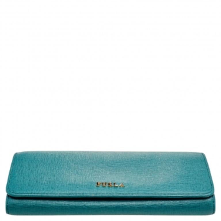 Made using teal green Saffiano leather, this continental wallet from Furla has a simple look and functional quality. It has a sleek interior featuring space for your cards, cash, and coins.