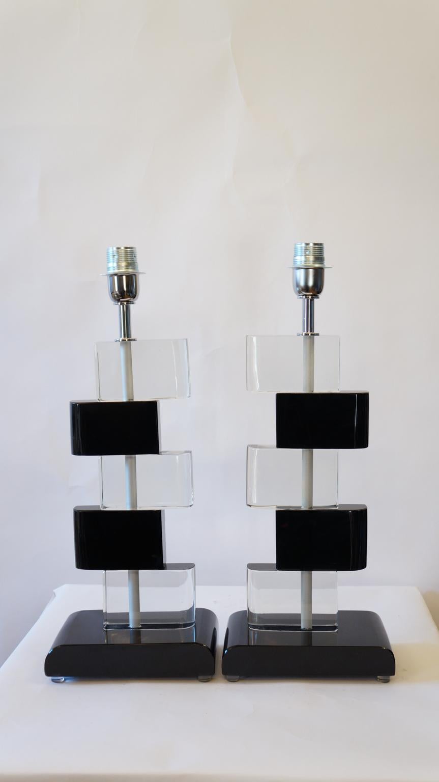 Two Murano glass table lamps by Alberto Donà in 1975. 
In it we can see simplicity, elegance, linearity. It is, in fact, a simple model, and it is thanks to its colors that its beauty stands out. 
We note in fact the combination of black and