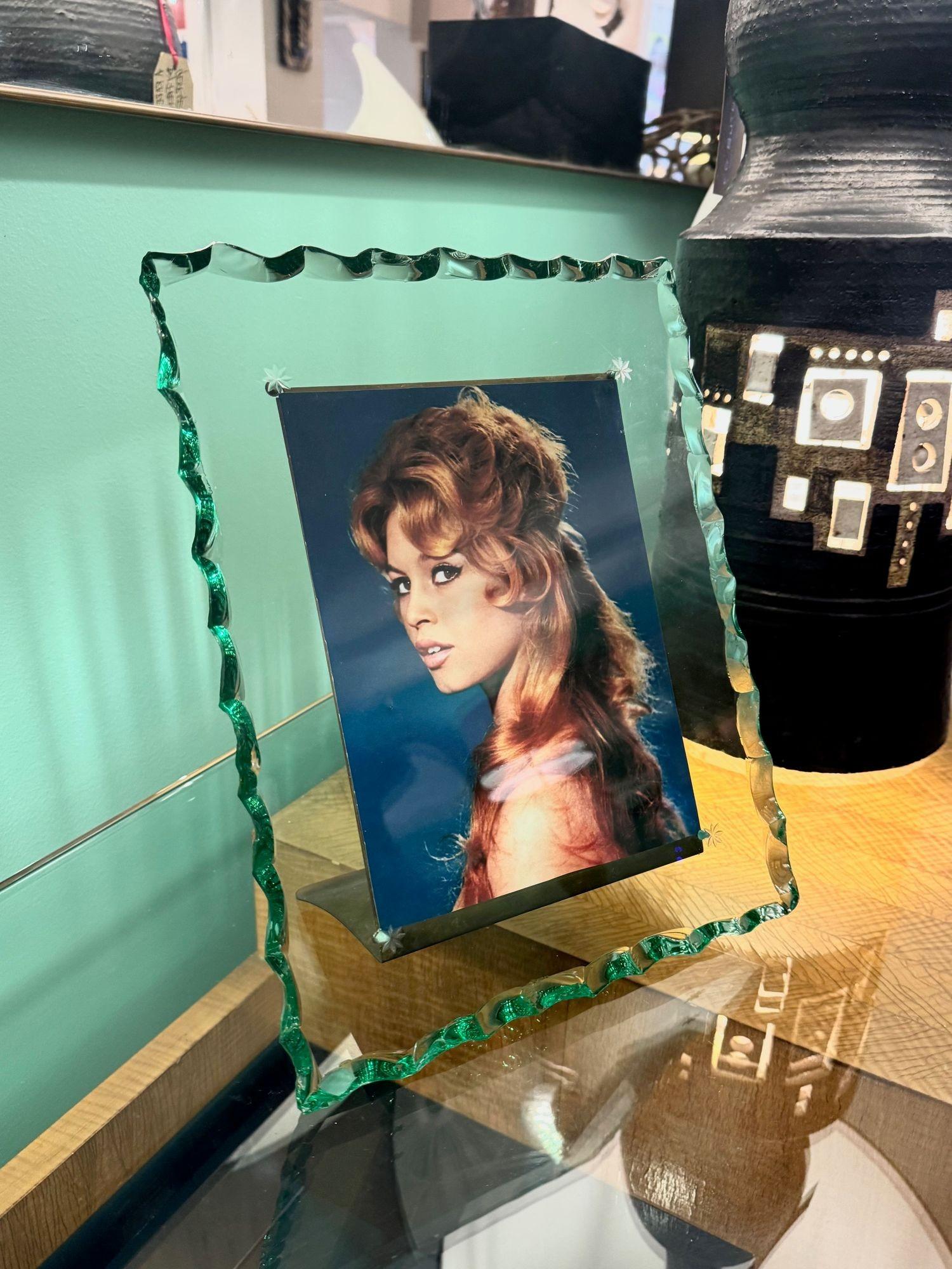 A 1930s glass and brass picture frame attributed to Pietro Chiesa for Fontana Arte with trade mark etched star corners and 