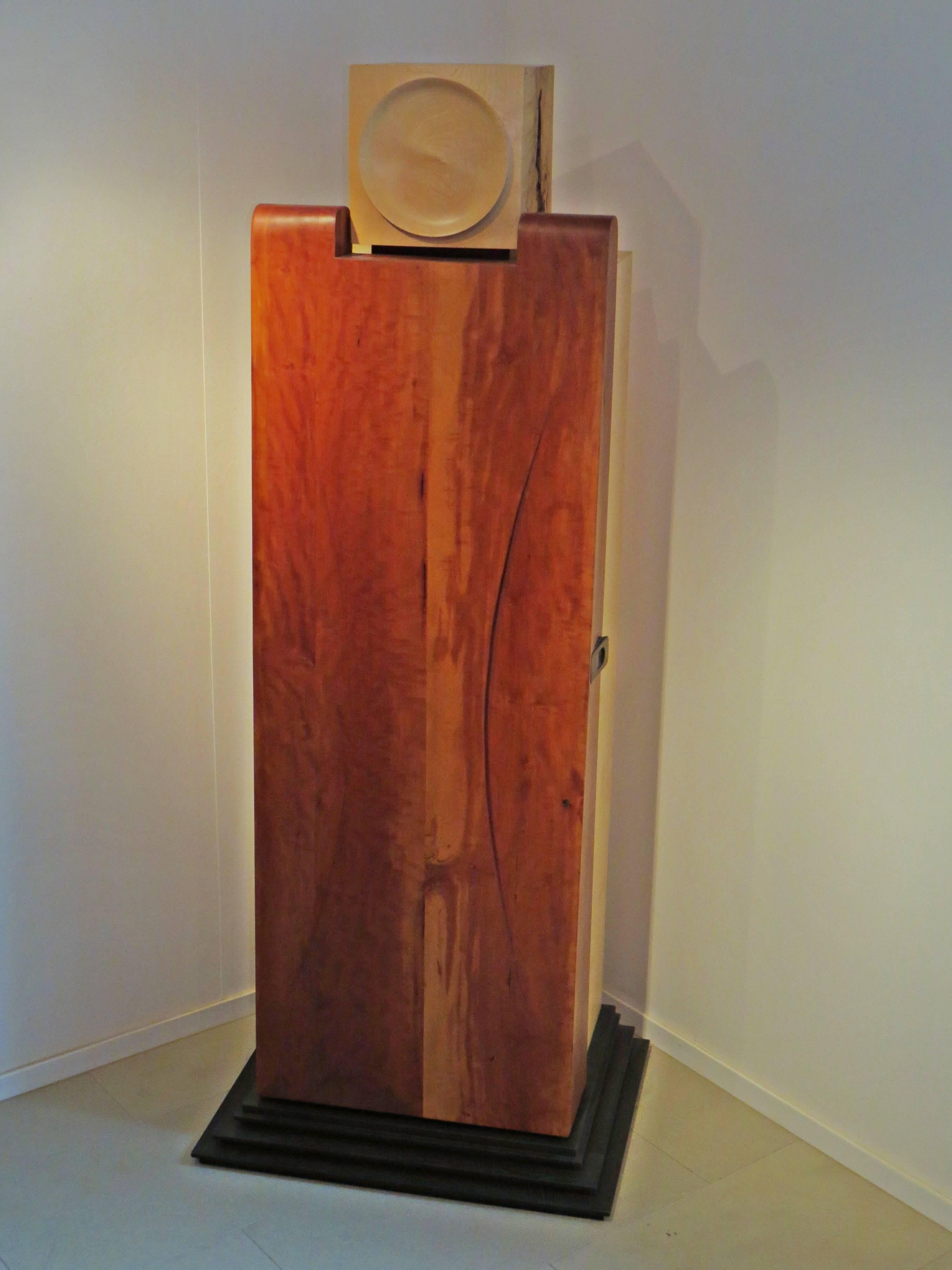 This cabinet sculpture was created by the German sculptor and furniture maker Eckehard Weimann.
An abstract human represents this furniture.
The head of fused maple with turned flap.
The pannier door made of pear wood, with organically elaborated