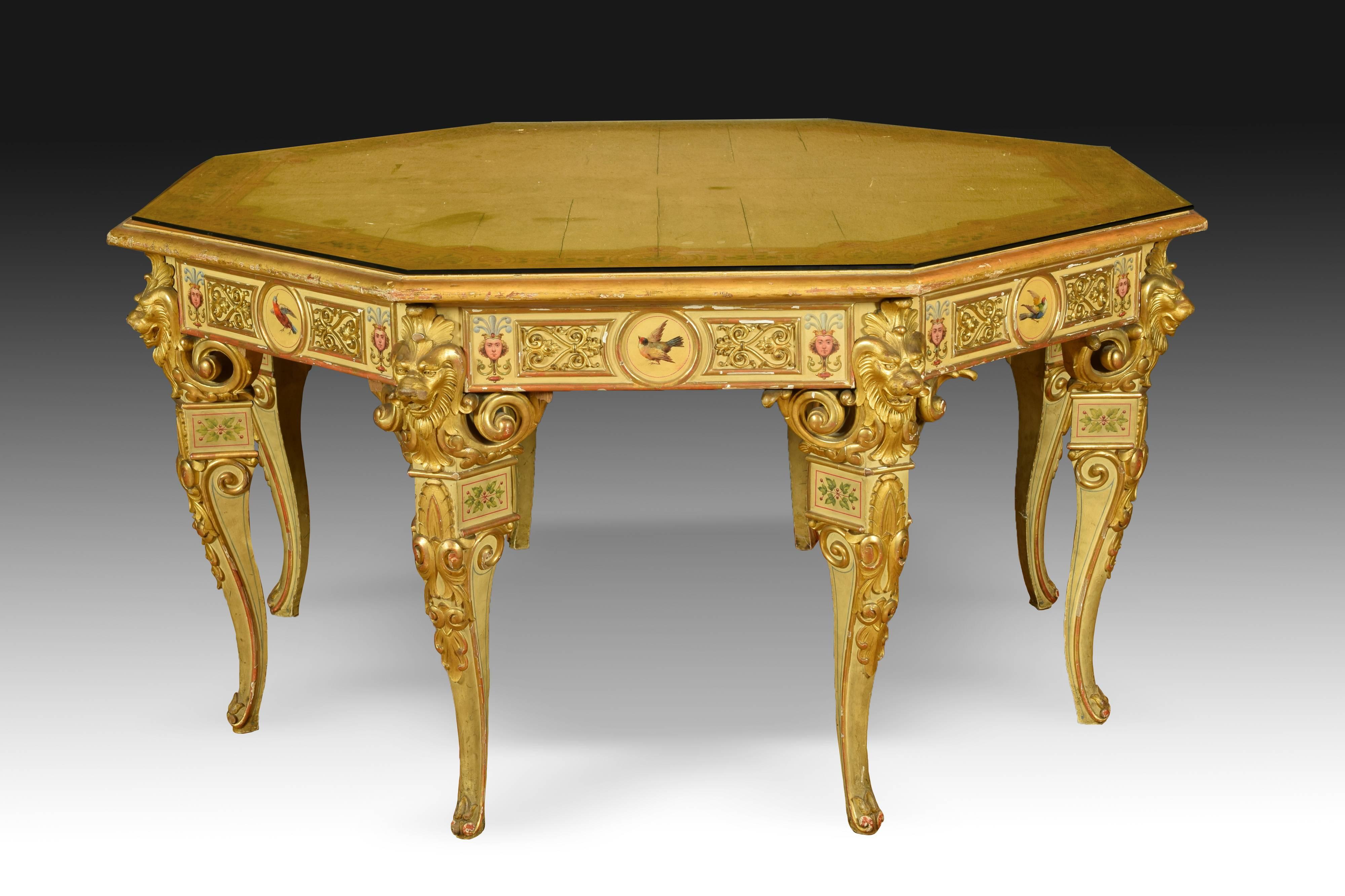 This set of furniture consists of six chairs with arms and back and an octagonal high table made of carved wood, polychrome and gold. The chairs are almost equal to each other (only two of them have the bird painted on the backrest facing to the