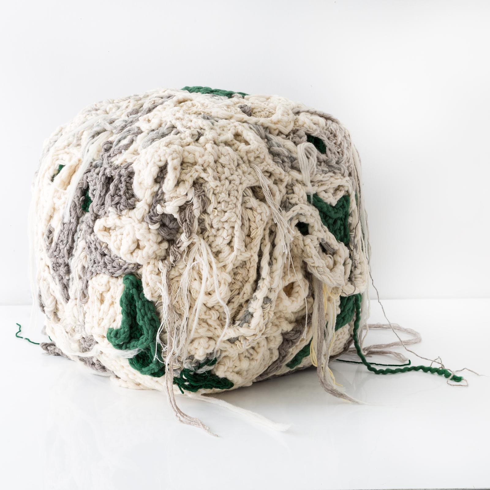 Further forms are a grouping of bright and hairy ottomans that have creature-like qualities. Tamika Rivera sculpts the Forms by wrapping, knitting and knotting yarn and string onto stuffed geometric forms. She builds off these forms to create this