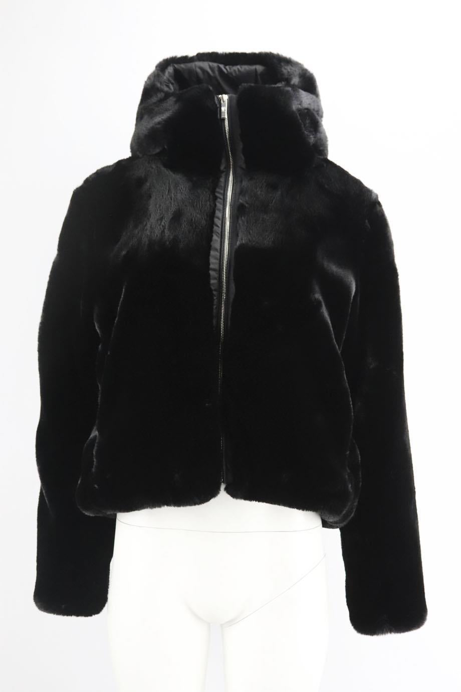Fusalp hooded faux fur jacket. Black. Long sleeve, crewneck. Zip fastening at front. 100% Polyester; lining: 94% polyester, 6% elastane; lining2: 100% polyamide; padding: 100% polyester; faux fur: 100% polyester. Size: FR 42 (UK 14, US 10, IT 46).