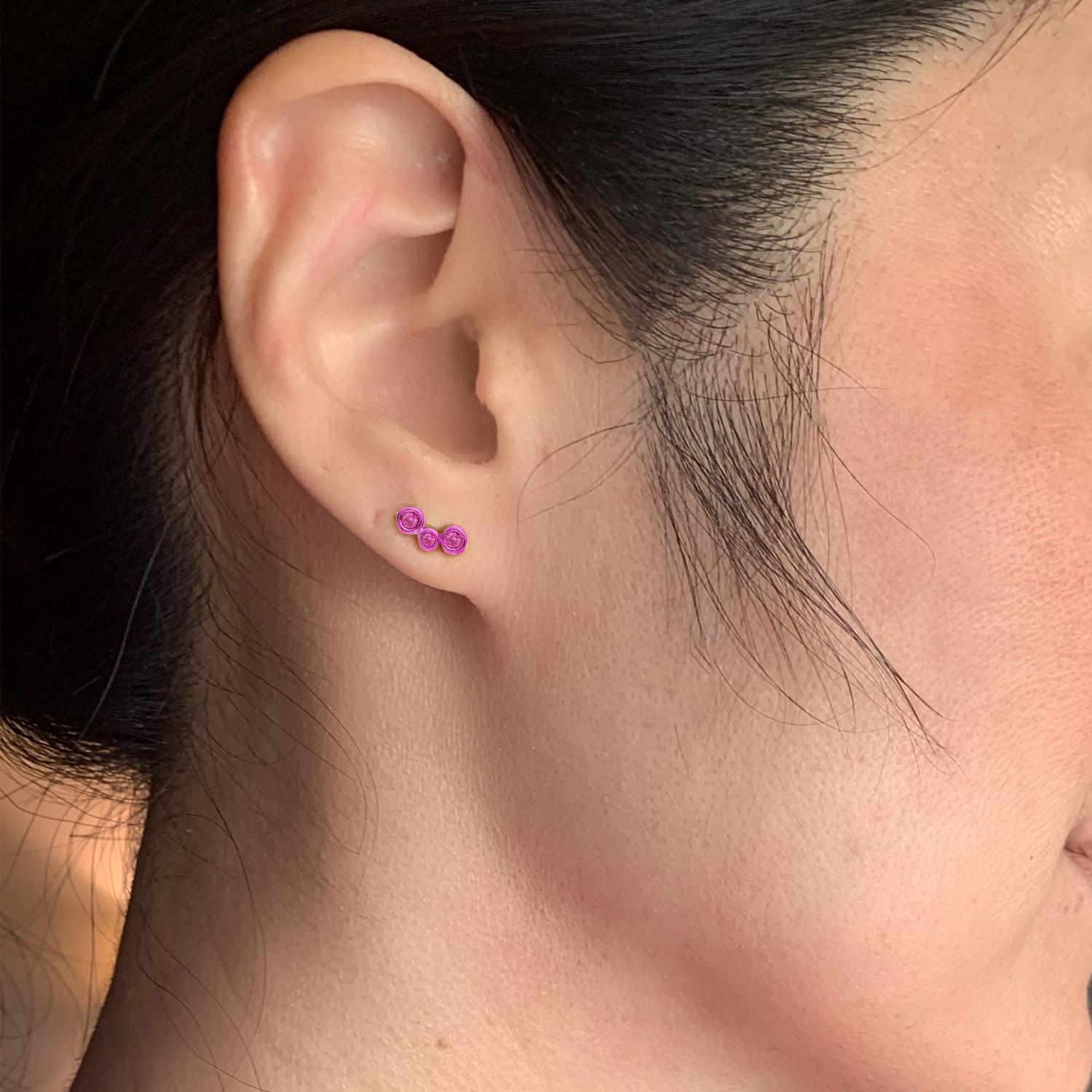 Hi June Parker's mini version of her climber earrings, adding a pop of
electric Fuschia Pink to your ears with this 3-stone SINGLE stud.

Inspired by seeing the cross-section view of life, as if slicing a tree to see its underlying structure and raw