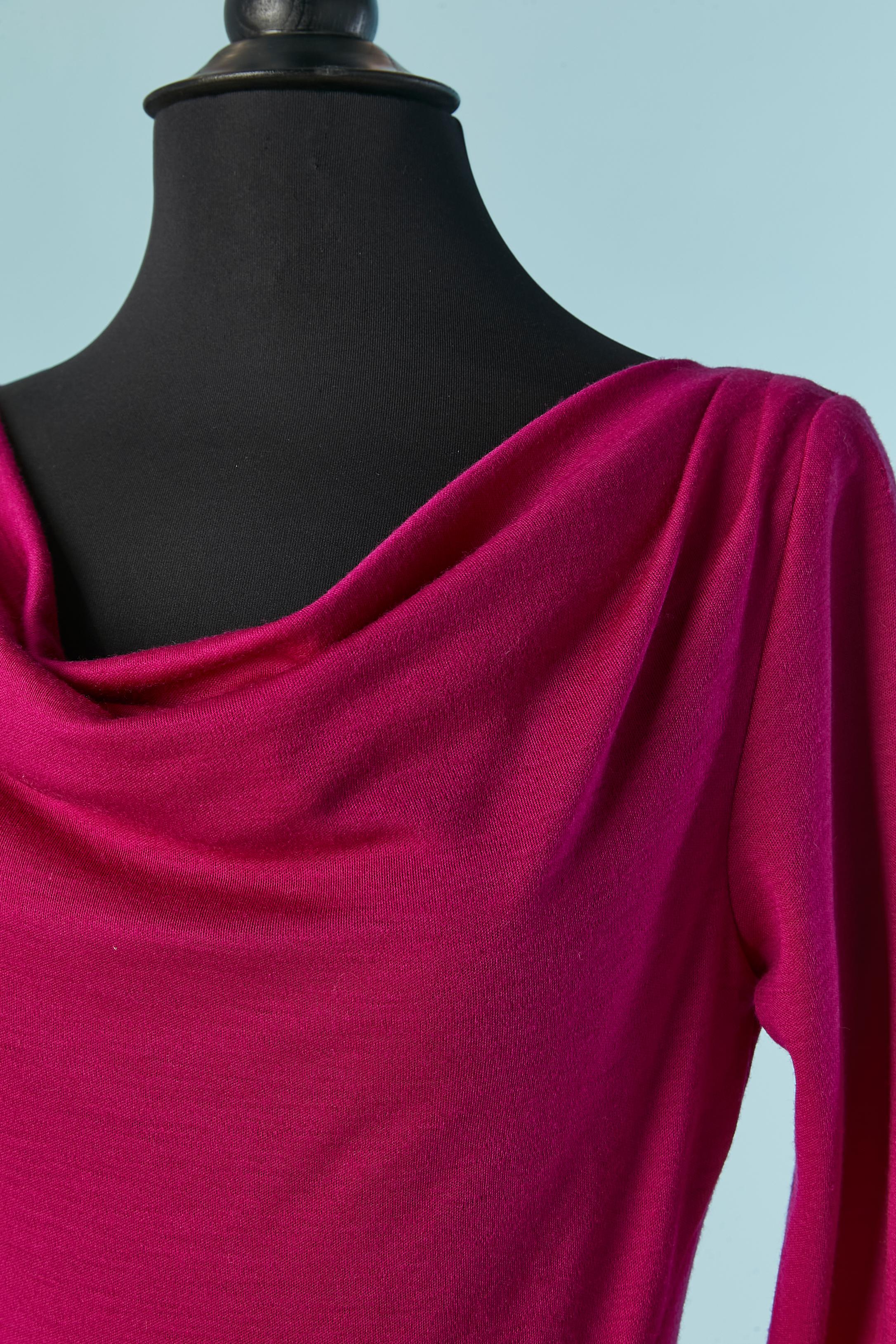 Fushia Wool jersey dress. Cut-work on the side. 
SIZE 4 