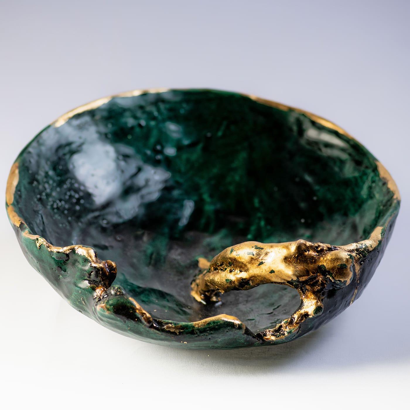 A one-of-a-kind ceramic piece merging art and functionality, this centerpiece bowl strikes with its dignity of authentic objet d'art. Marked by an irregular texture and rim, it incorporates the silhouette of a naked woman seemingly emerging for a