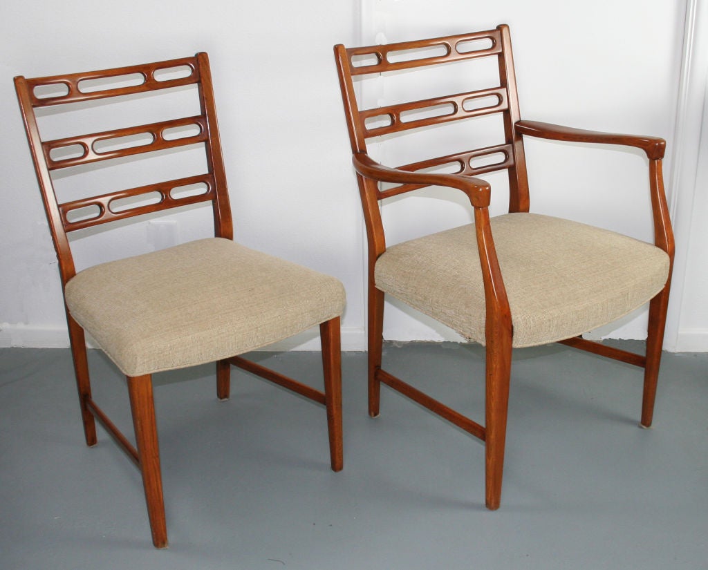 Two armchairs and two side chairs with stunning sculptural backs by David Rosèn for Nordiska Kompaniet. Cherry hand carved horizontal back splats and curvaceous arms are incredibly sexy. Side chairs are 18
