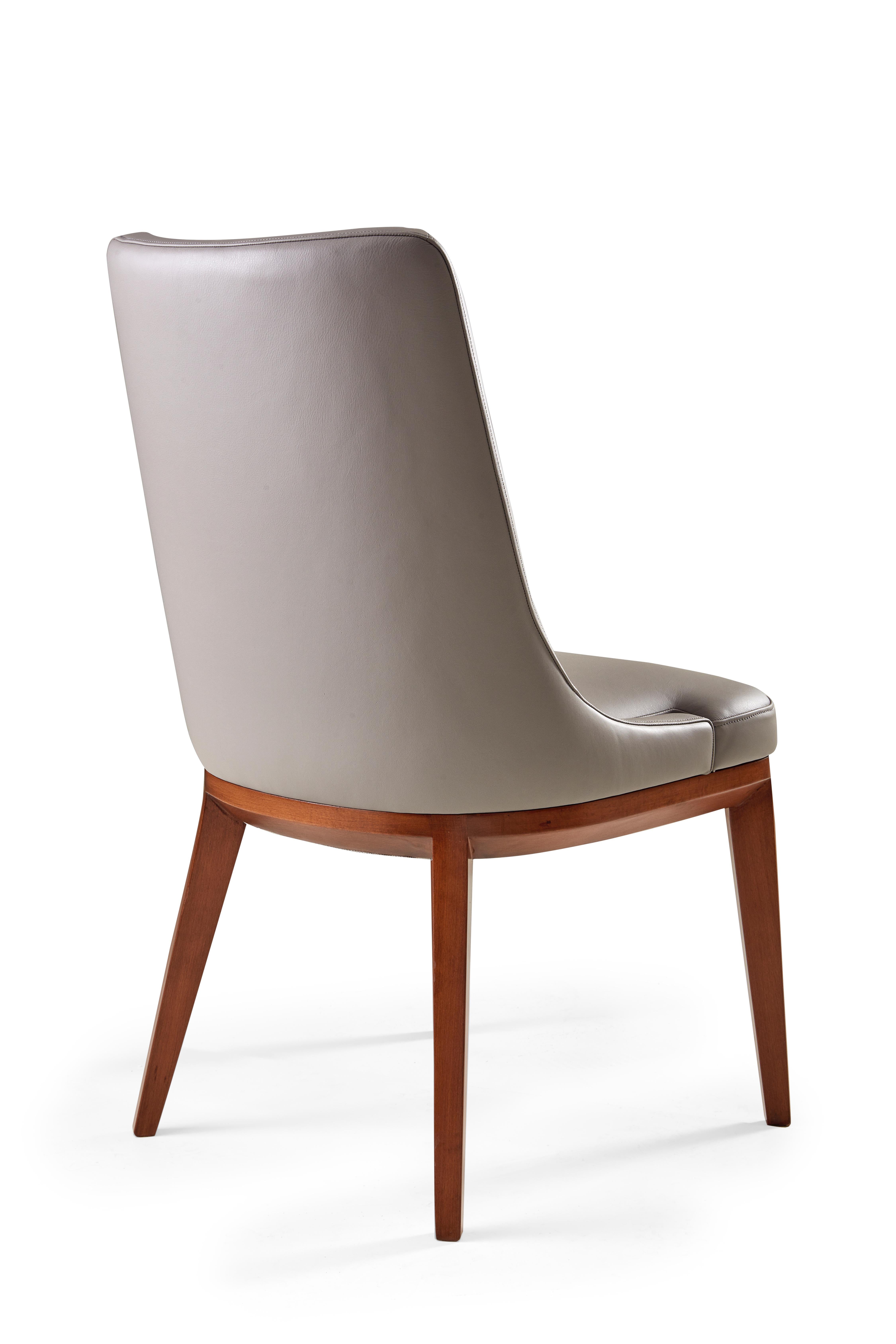 There is beauty in such simplicity. This tight upholstered chair on wood legs features a clean design with high style. Use leather for a more modern look, or soften with one of our many soft to the touch fabrics.