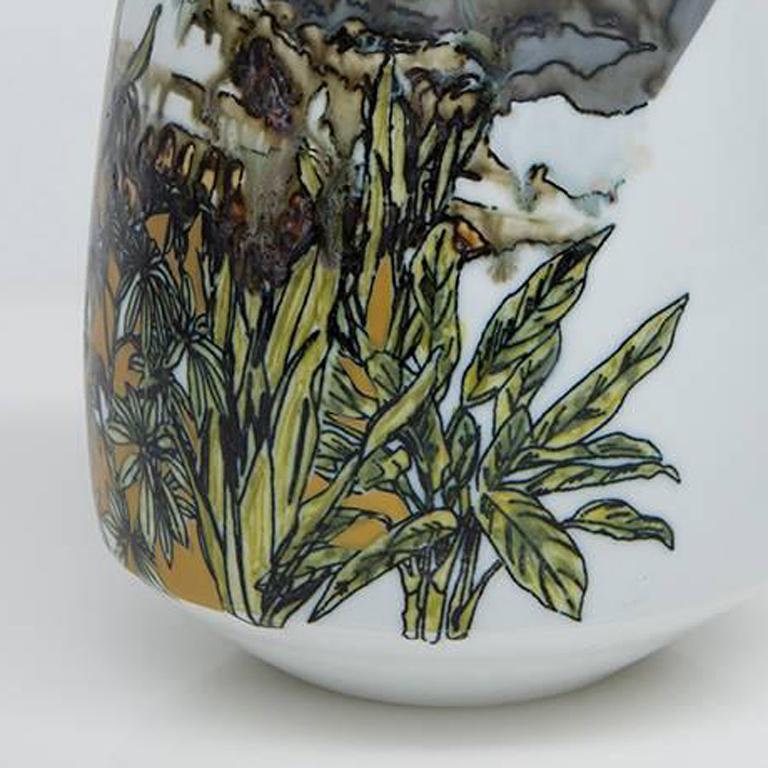 This is a beautifully and perfectly crafted ceramic vase. It has varies flora and fauna drawn on it in the form of decals. It ranges in colors from bright yellows and pinks to murky browns and greens, to bring that truly 