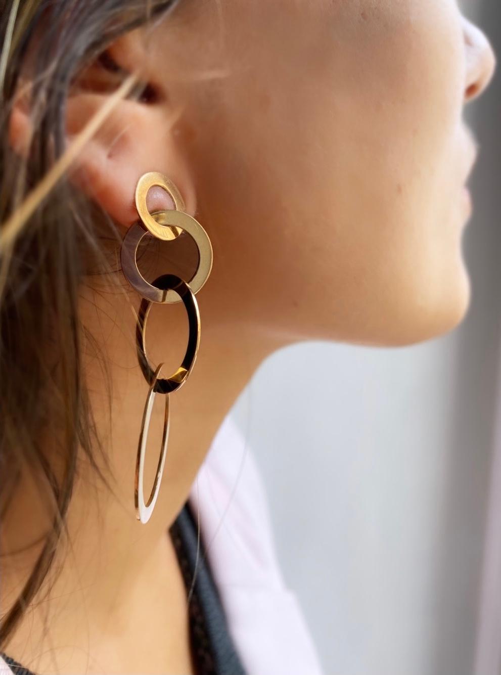 Rossella Ugolini Design Collection, four hoops Handcrafted in Italy from 18k Yellow Gold are chained in a graceful gradation from the smallest on the lobe to the largest, creating a stunningly futuristic and feminine swing. 
The interlocking