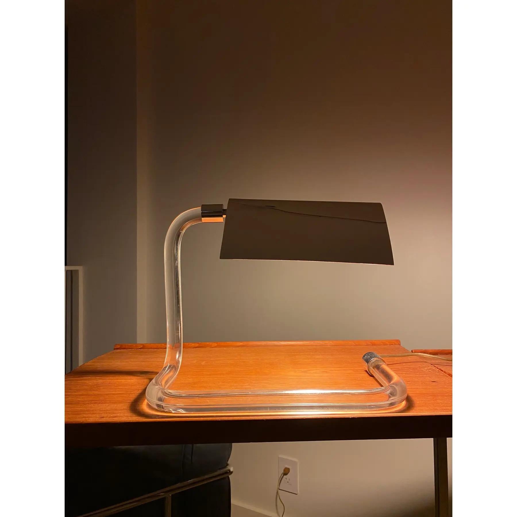 Table Lamp designed by Peter Hamburger for Knoll International c 1960s. Constructed from acrylic with adjustable chromed metal shade. Excellent condition. Kovacs produced this lamp for Knoll International.

13ʺW × 7ʺD × 11ʺL

A light, yet sculptural