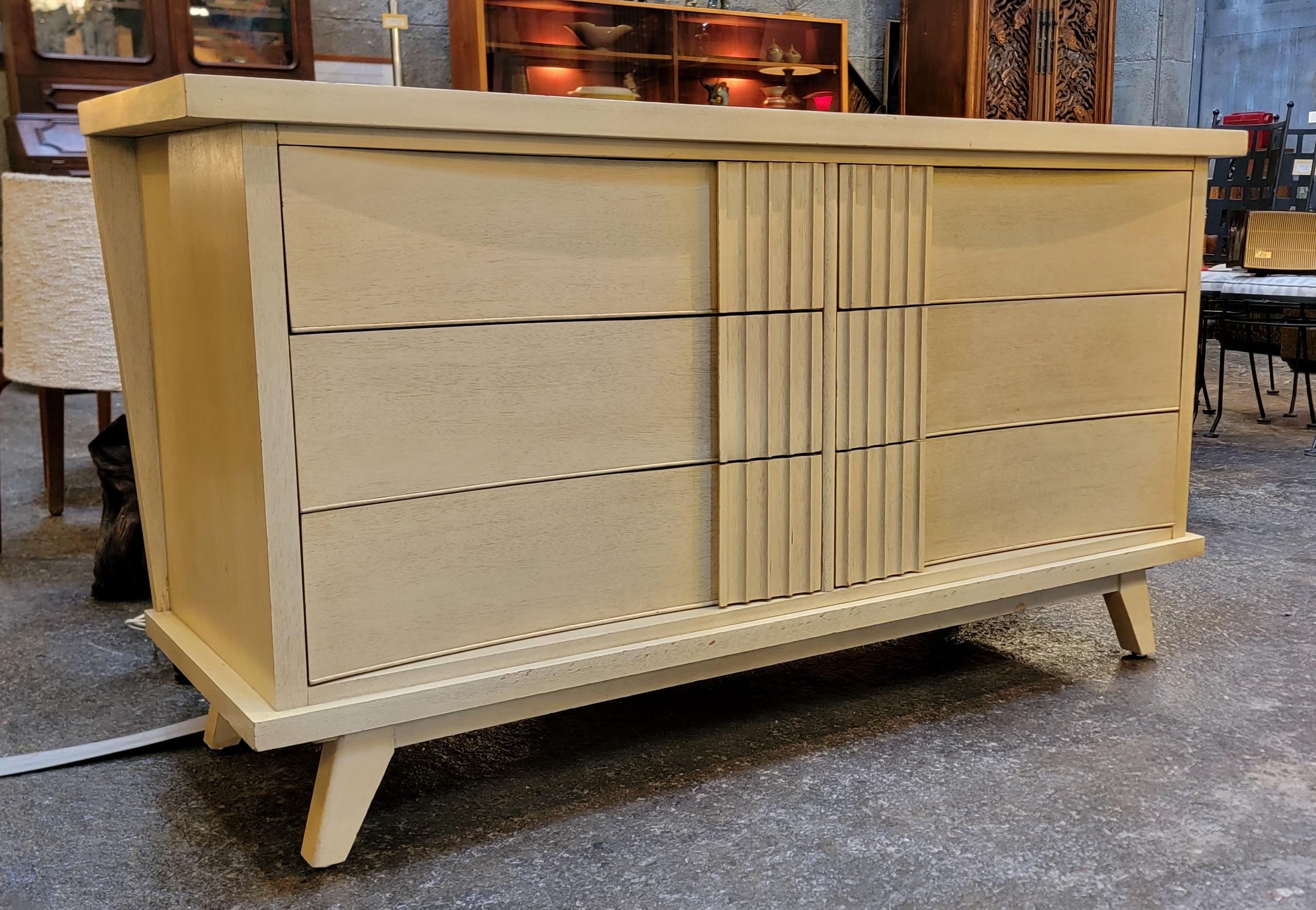 A Futuristic Style low 6 drawer dresser by Dixie Furniture Company. Original cerused / painted finish. Solid oak secondary woods with dovetail construction. Drawers glide easily. All wood materials. Very good original vintage condition. 