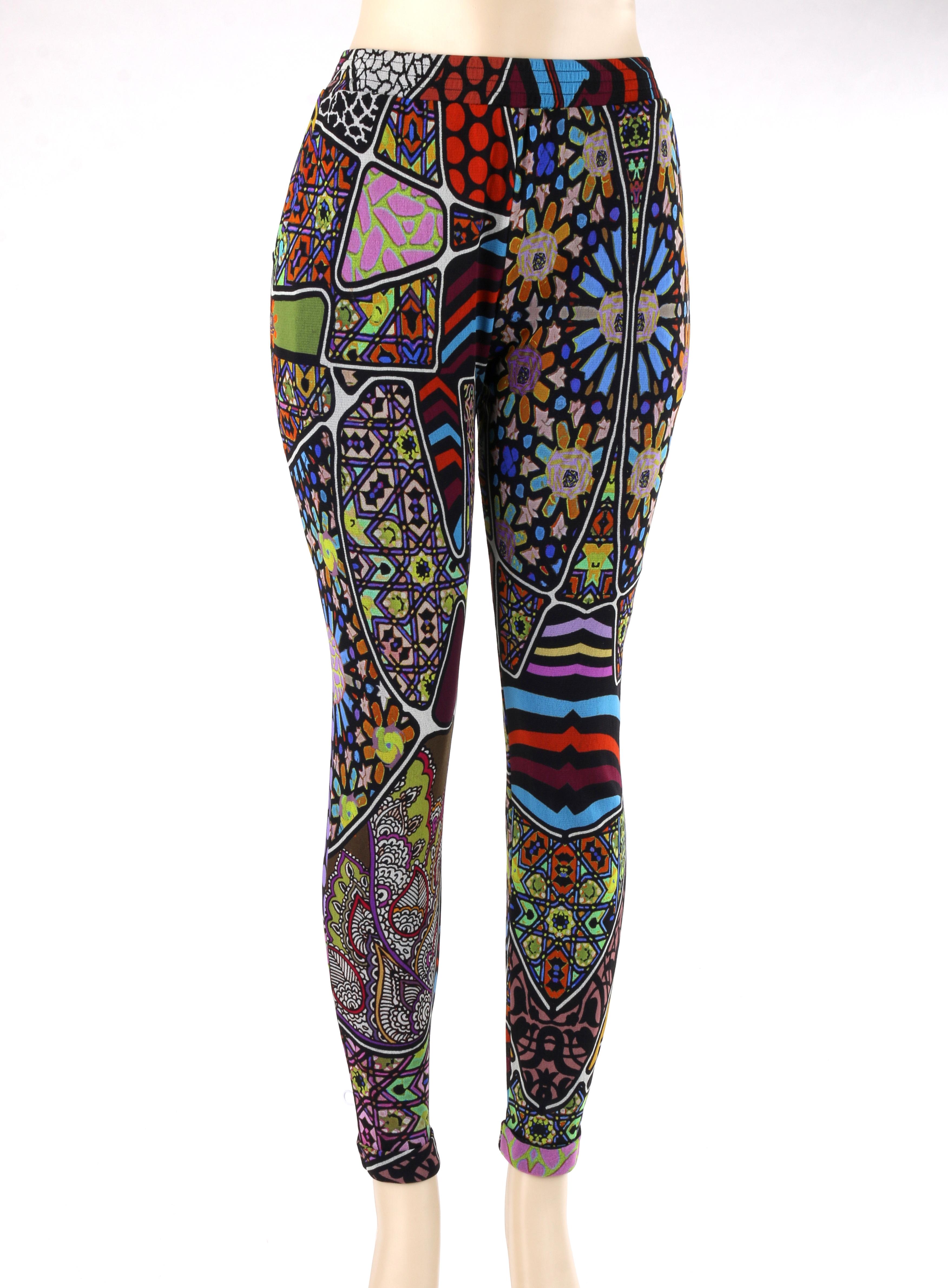FUZZI Jean-Paul Gaultier c.2000's Multicolor Mixed Pattern Mesh Legging Pants
 
Brand / Manufacturer: Fuzzi
Designer: Jean Paul Gaultier
Style: Legging pants
Color(s): Shades of blue, purple, yellow, orange, green, brown, and red
Lined: Yes
Marked