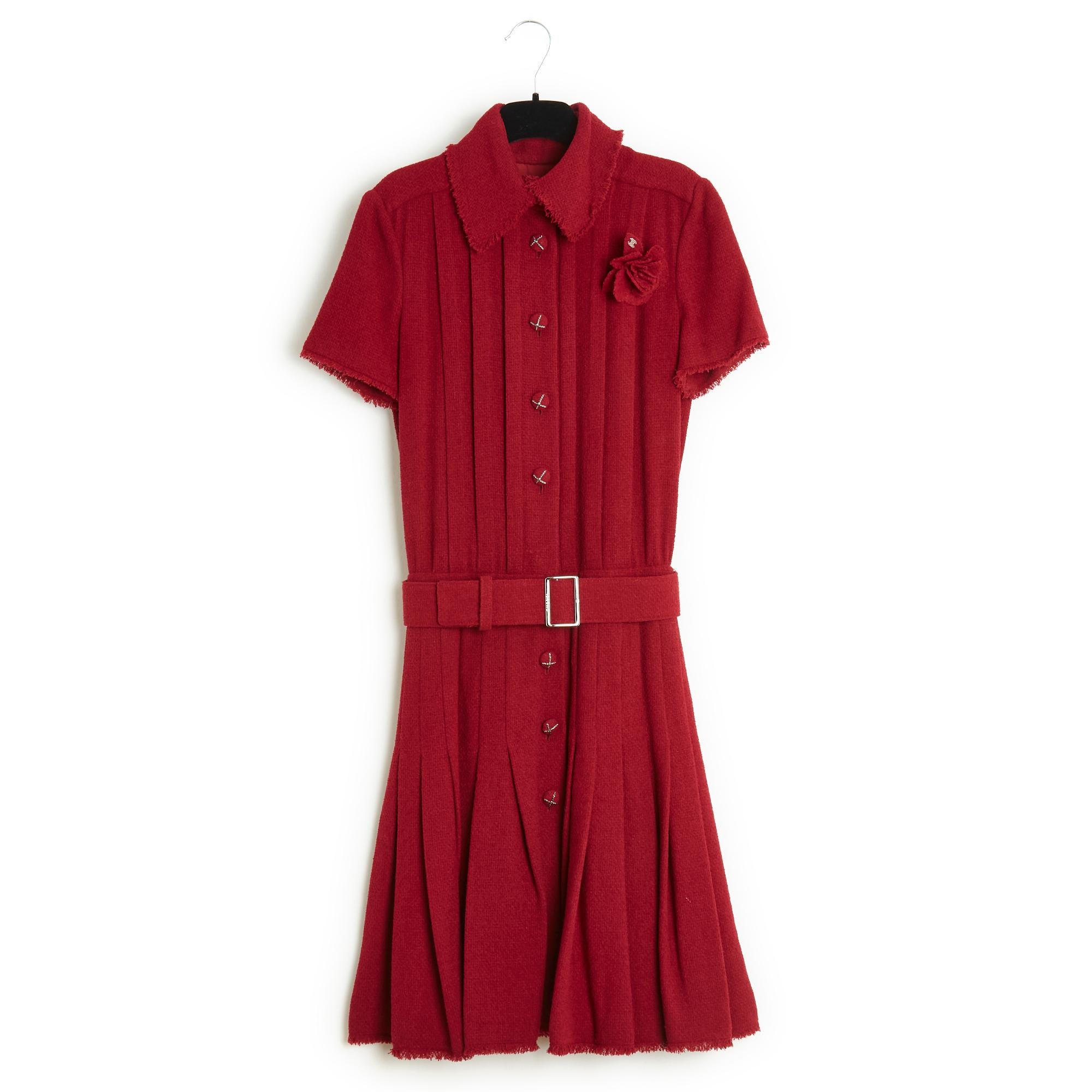 Chanel dress from the AW 2007 collection in dark red wool terry with frayed edges, mid-length, short sleeves, shirt collar closed with 8 jeweled buttons all the way up, hooks and snaps at the waist, under the matching adjustable belt to slide over