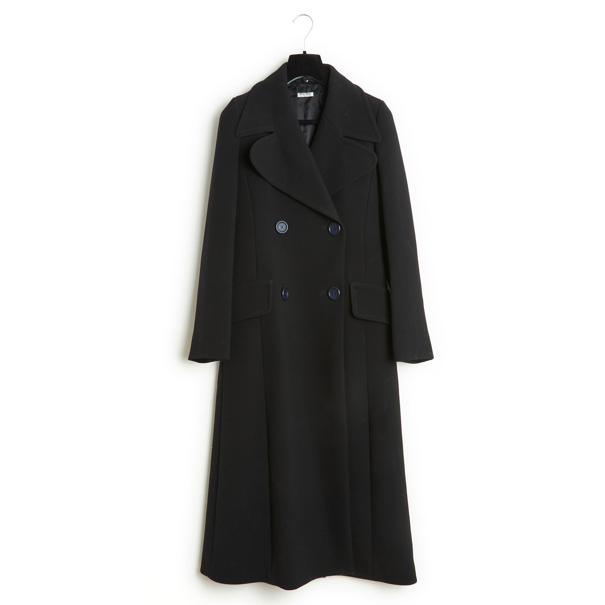 Miu Miu coat AW 2015 collection in thick black wool twill, wide notched collar partially covered with a removable tricolor smooth leather collar, double-breasted front, 2 flap pockets on the sides, long sleeves, long slit at the back, lining satin